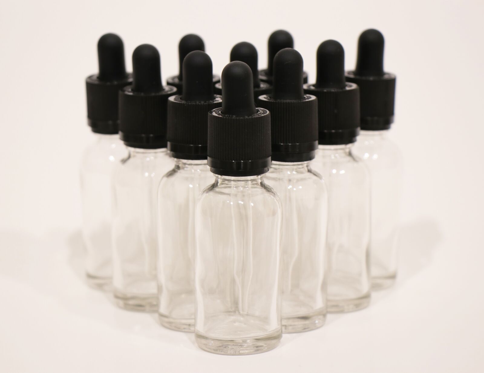 Canon EF-S 18-135mm F3.5-5.6 IS USM sample photo. Clear, glass dropper, bottles photography