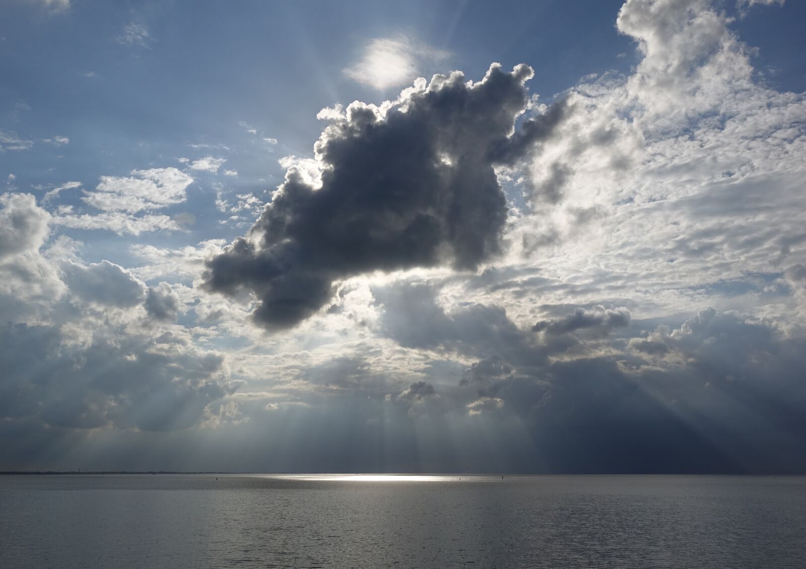 Sony Cyber-shot DSC-RX10 sample photo. Cloud formation, sea, sunbeam photography