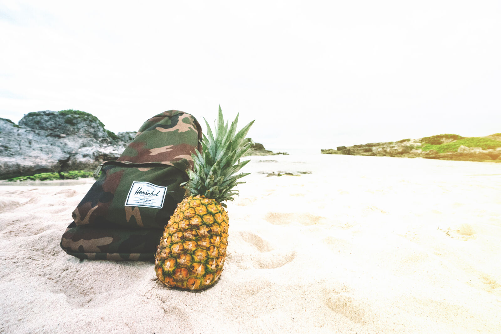 Sony Vario-Tessar T* FE 16-35mm F4 ZA OSS sample photo. Backpack, beach, beachlife, camouflage photography