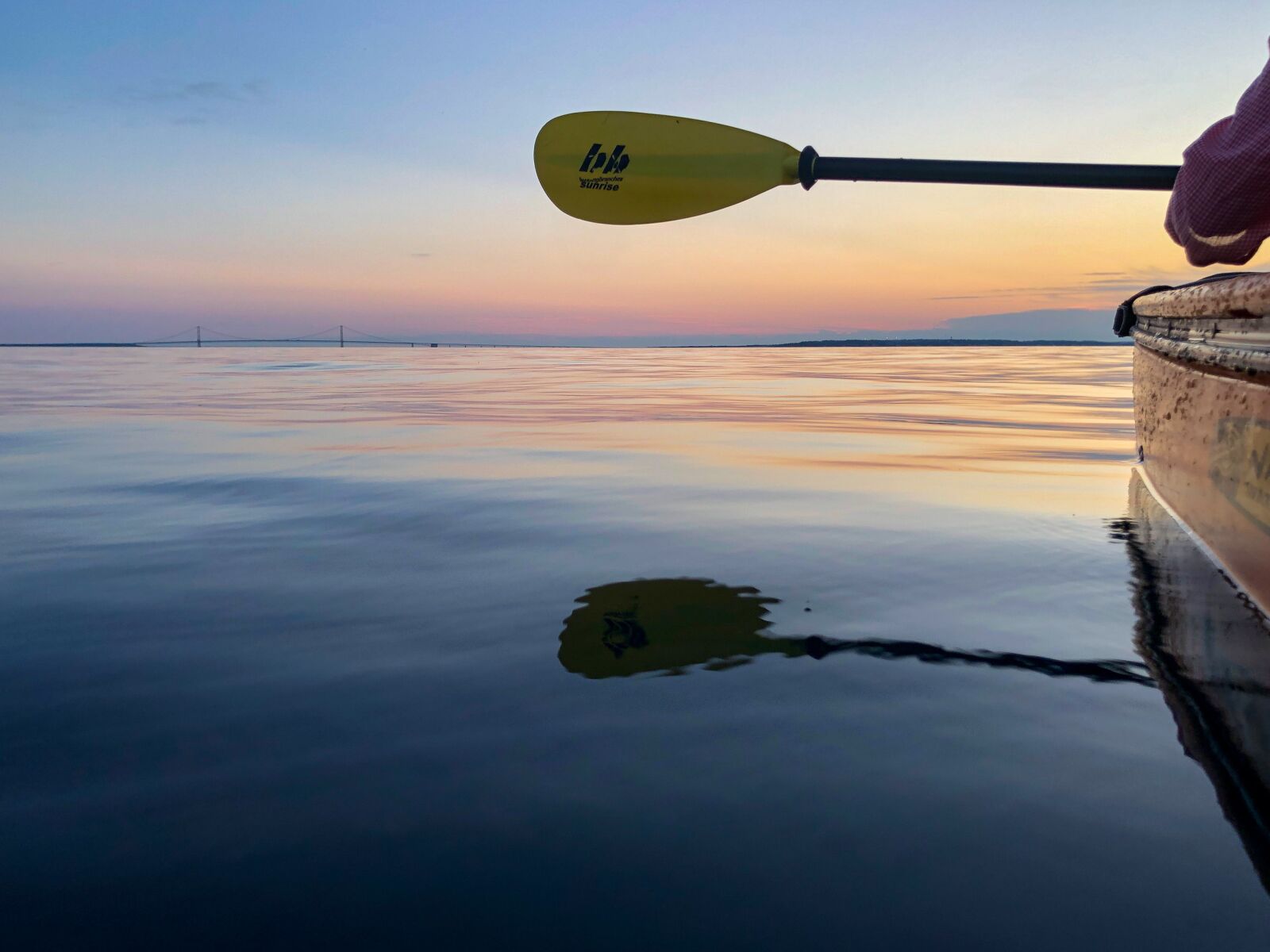 iPhone X back dual camera 4mm f/1.8 sample photo. Kayaking, smooth water, golden photography
