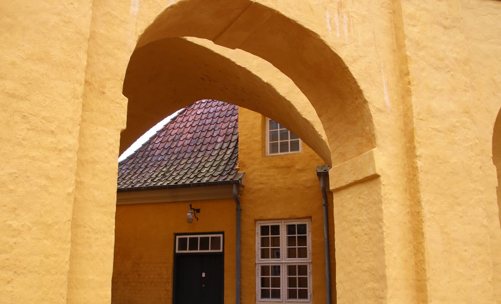 Canon EOS 7D Mark II sample photo. Arches, building, door, old photography