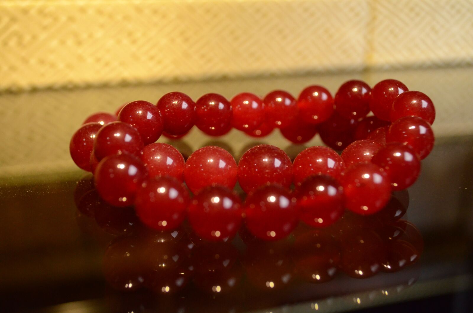 Nikon D5100 sample photo. Red stone, ornament, bracelet photography