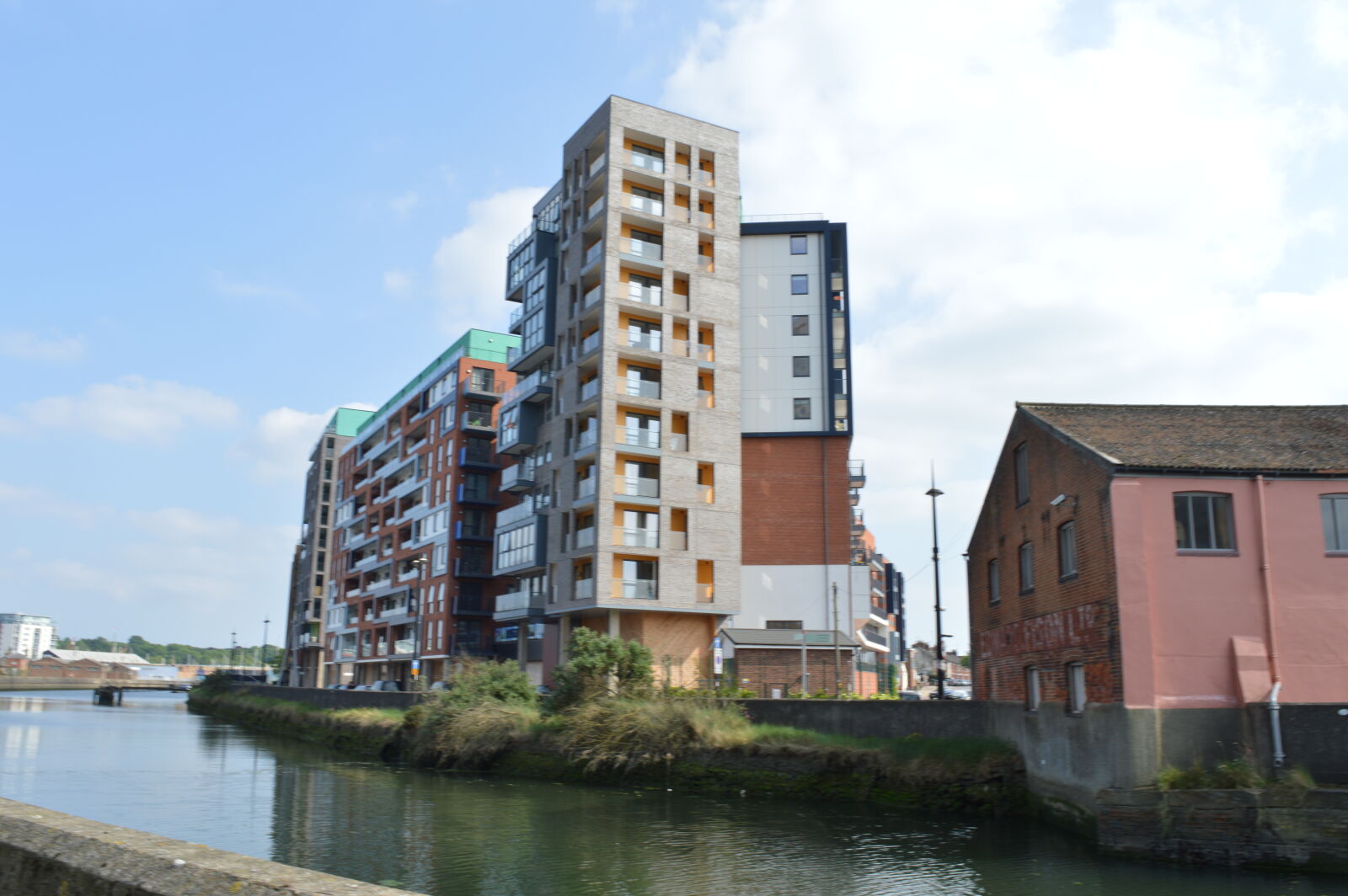 Nikon D3200 sample photo. Apartment, buildings, river, tower photography
