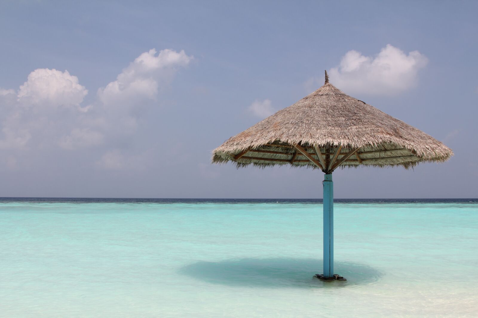 Canon EOS 60D + Canon EF 24-105mm F4L IS USM sample photo. Maldives, island, parasol photography