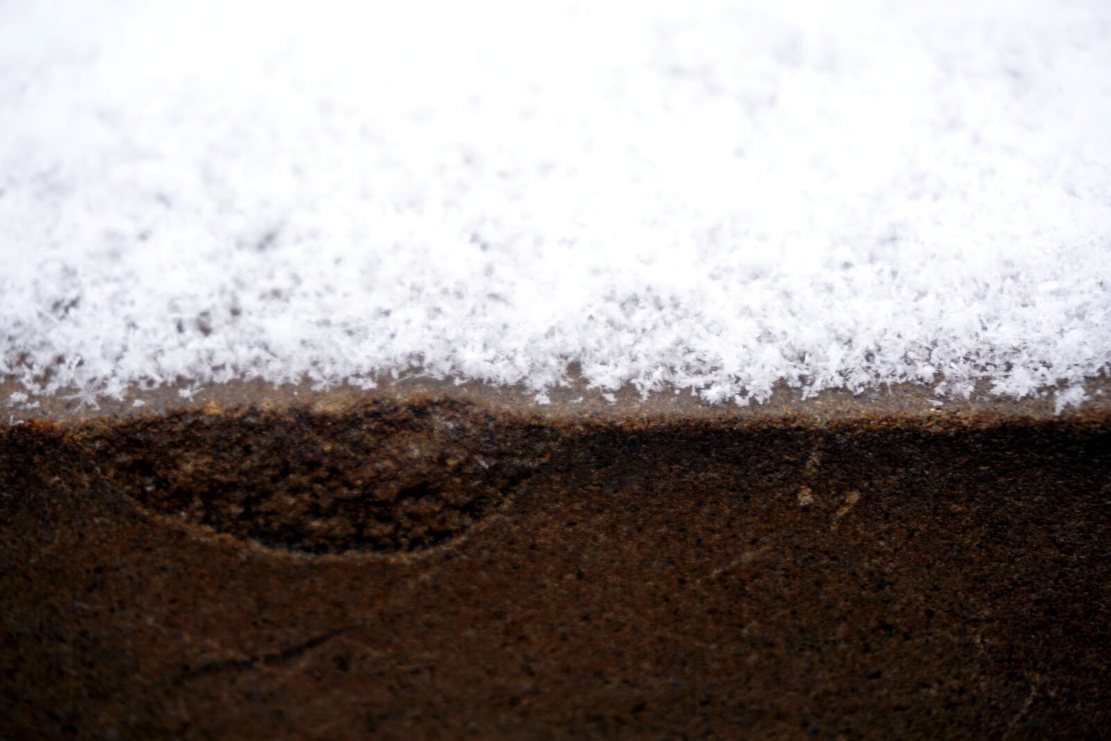 Sony E 16-50mm F3.5-5.6 PZ OSS sample photo. Brown, outdoor, snow, wall photography