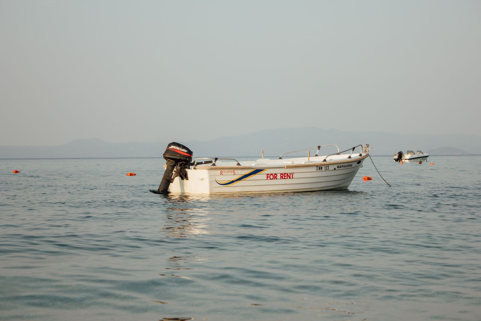 Canon EF-S 18-55mm F3.5-5.6 IS sample photo. Motorboat, engine, boat, calm photography