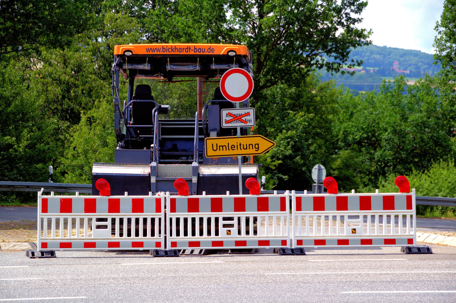 Nikon D3100 sample photo. Redirect, road block his photography