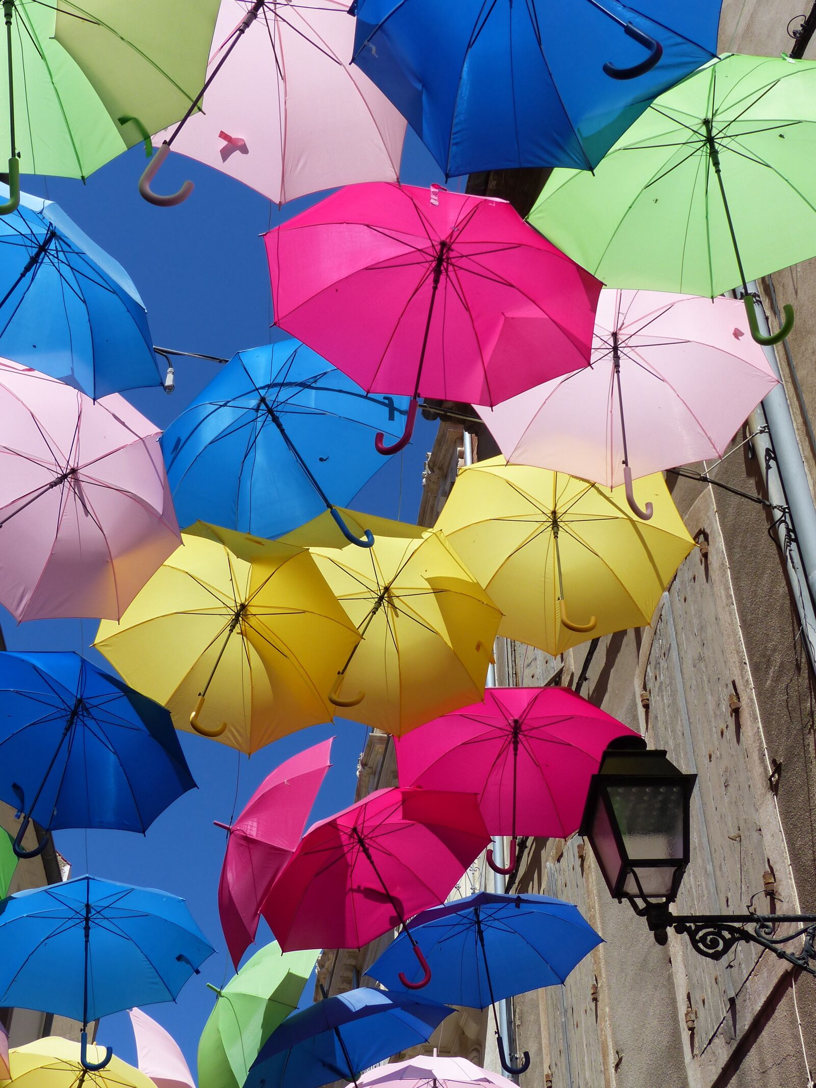 Panasonic Lumix DMC-FZ200 sample photo. Umbrellas, colorful, blue sky photography