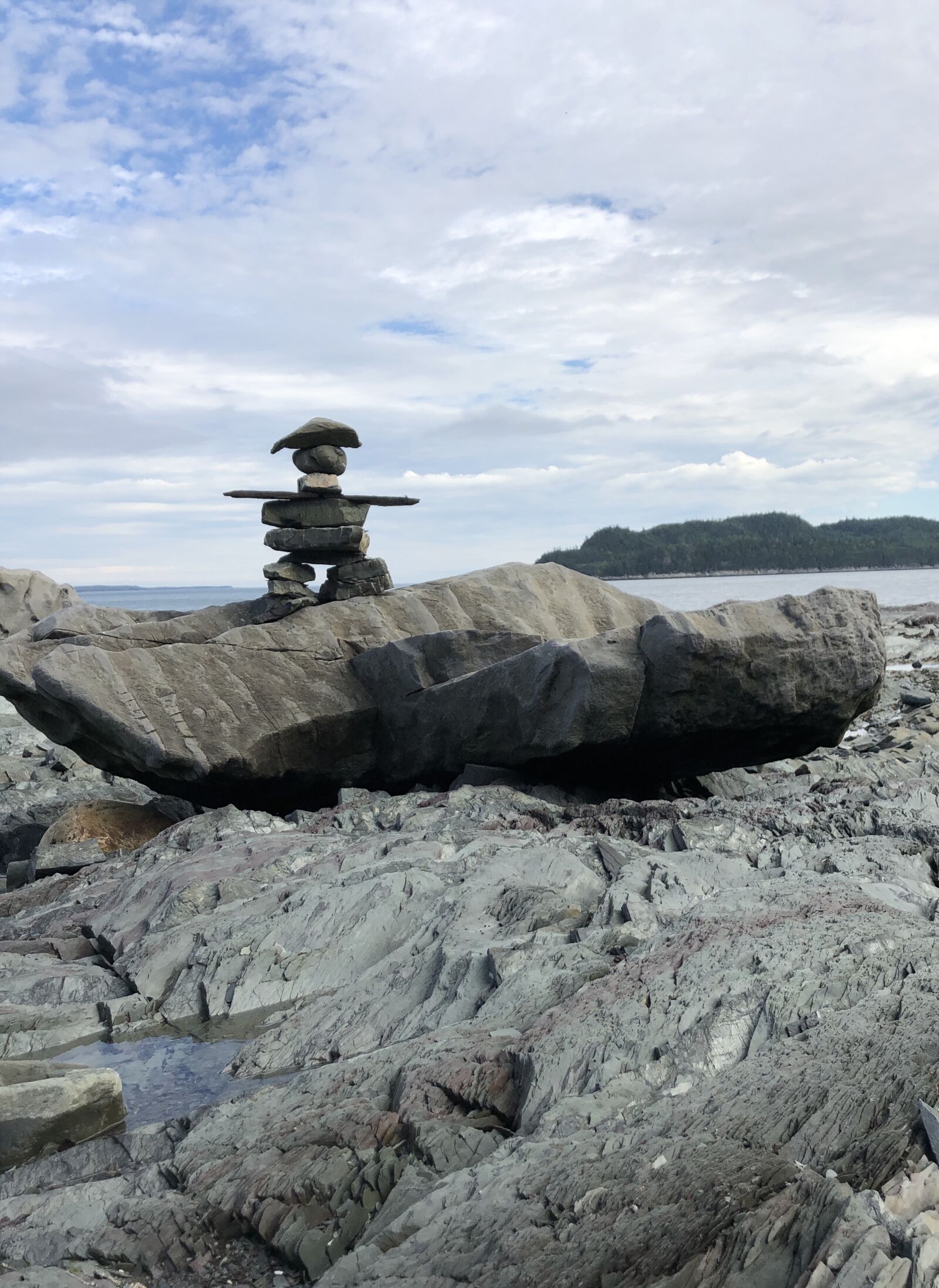 iPhone 8 back camera 3.99mm f/1.8 sample photo. Inuksuk, peaceful, rocks photography