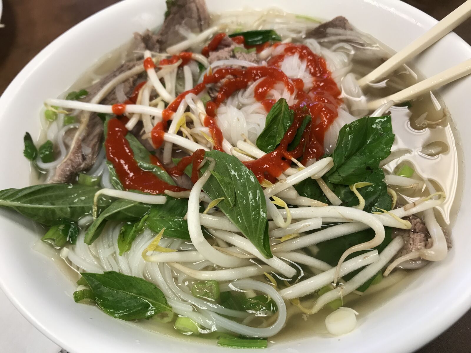 iPhone 7 Plus back dual camera 3.99mm f/1.8 sample photo. Pho, sriracha, noodles photography