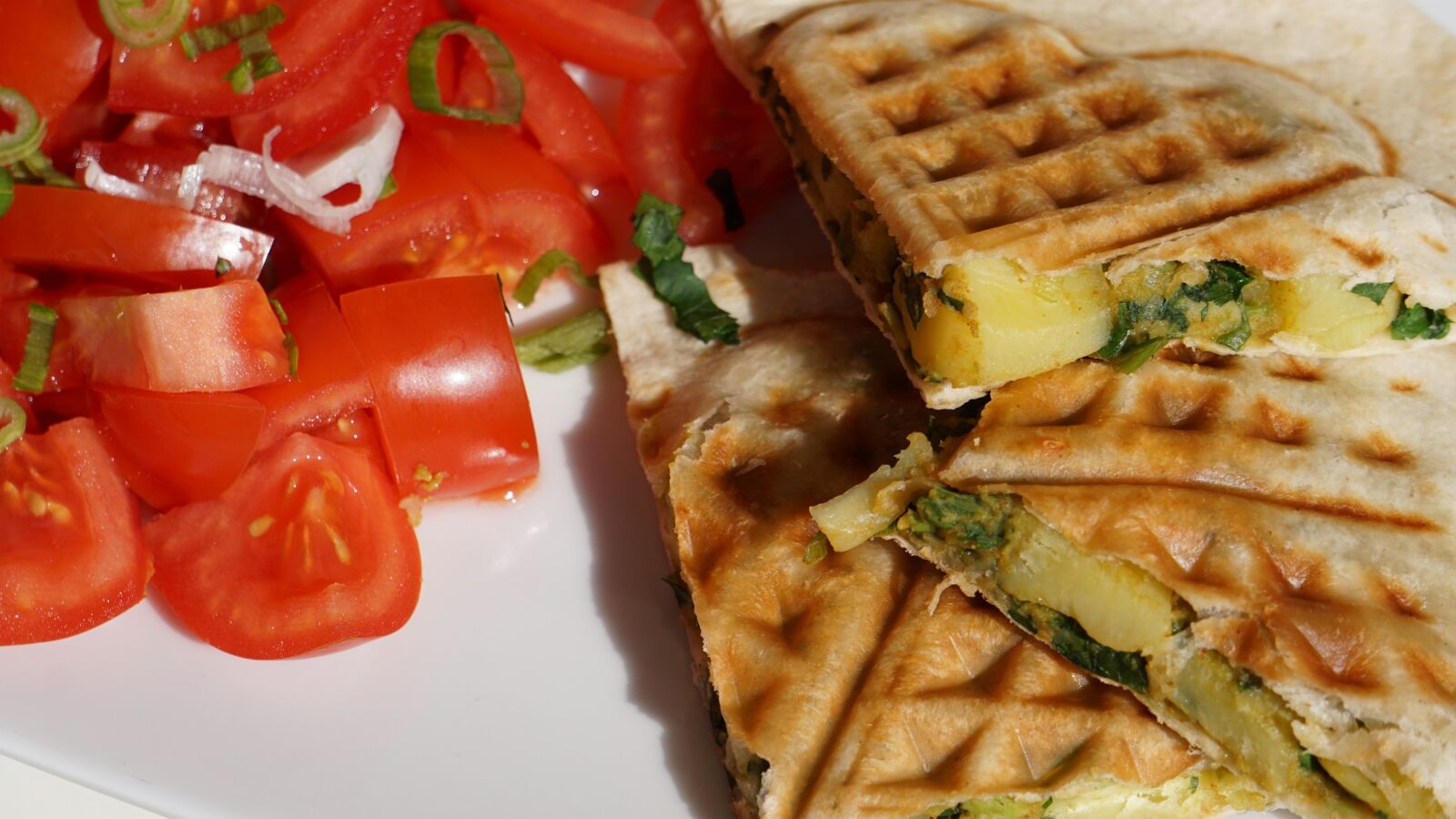 Sony E 55-210mm F4.5-6.3 OSS sample photo. Tortillas, tomatoes, fr hings photography