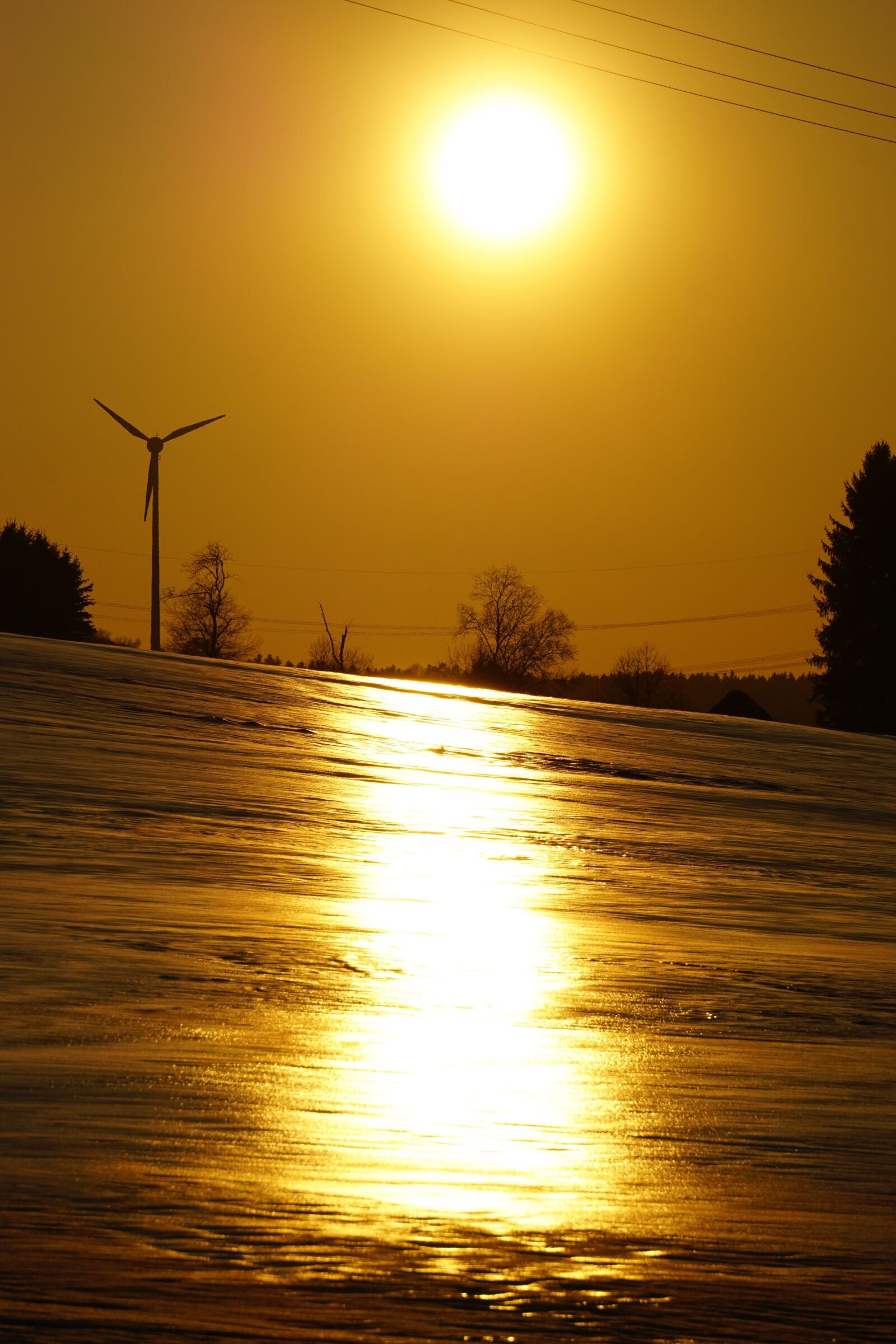 Sony E 55-210mm F4.5-6.3 OSS sample photo. Sunset, snow, sun photography