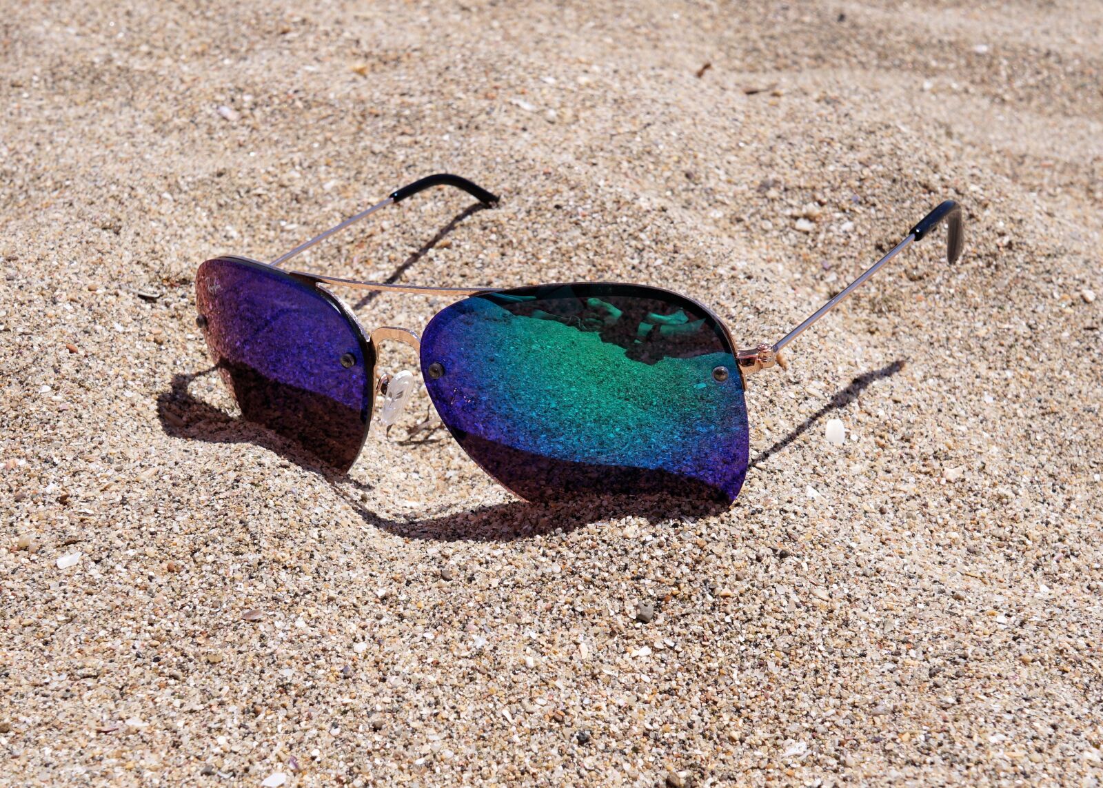 Sony a6000 + Sigma 19mm F2.8 EX DN sample photo. Sunglasses, sand, beach photography