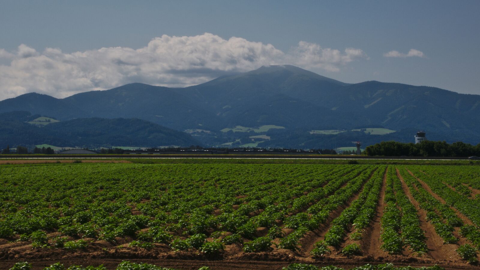 Panasonic Lumix DMC-G85 (Lumix DMC-G80) sample photo. Green, field, mountain photography