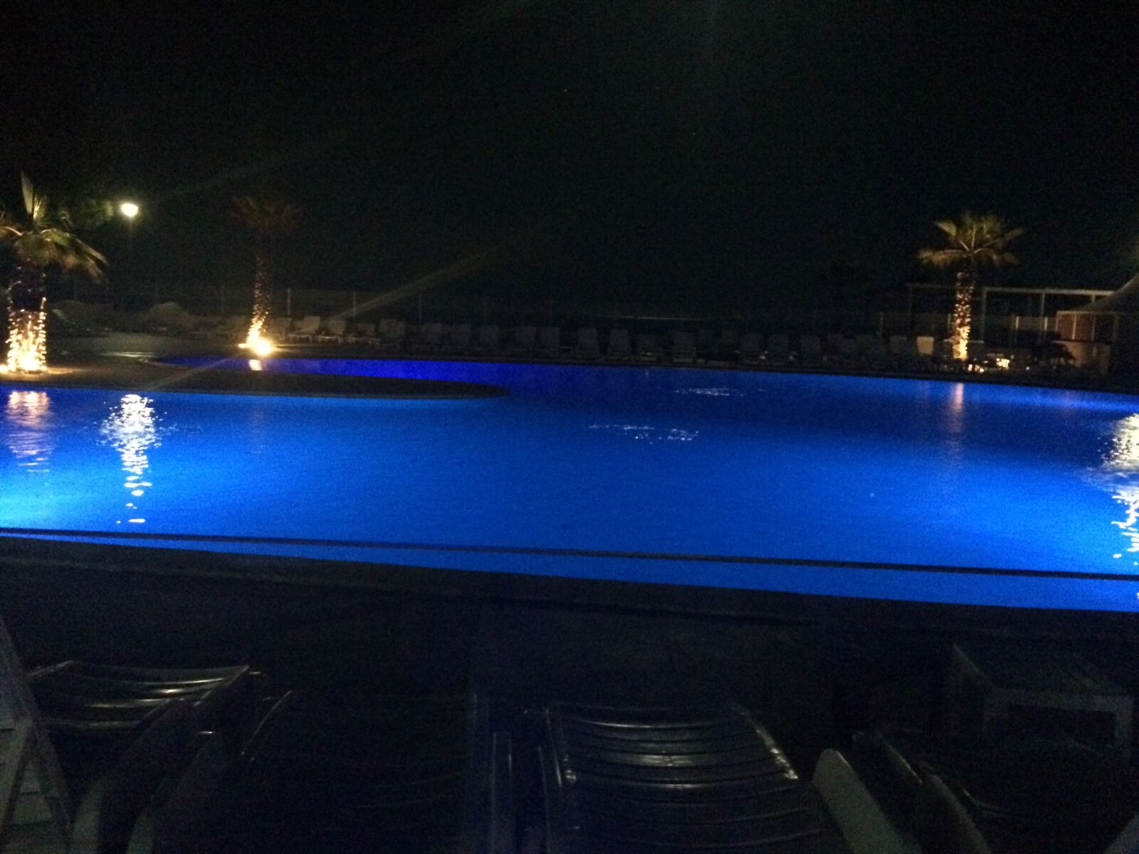 iPhone 5s back camera 4.15mm f/2.2 sample photo. Swimming pool, night, water photography
