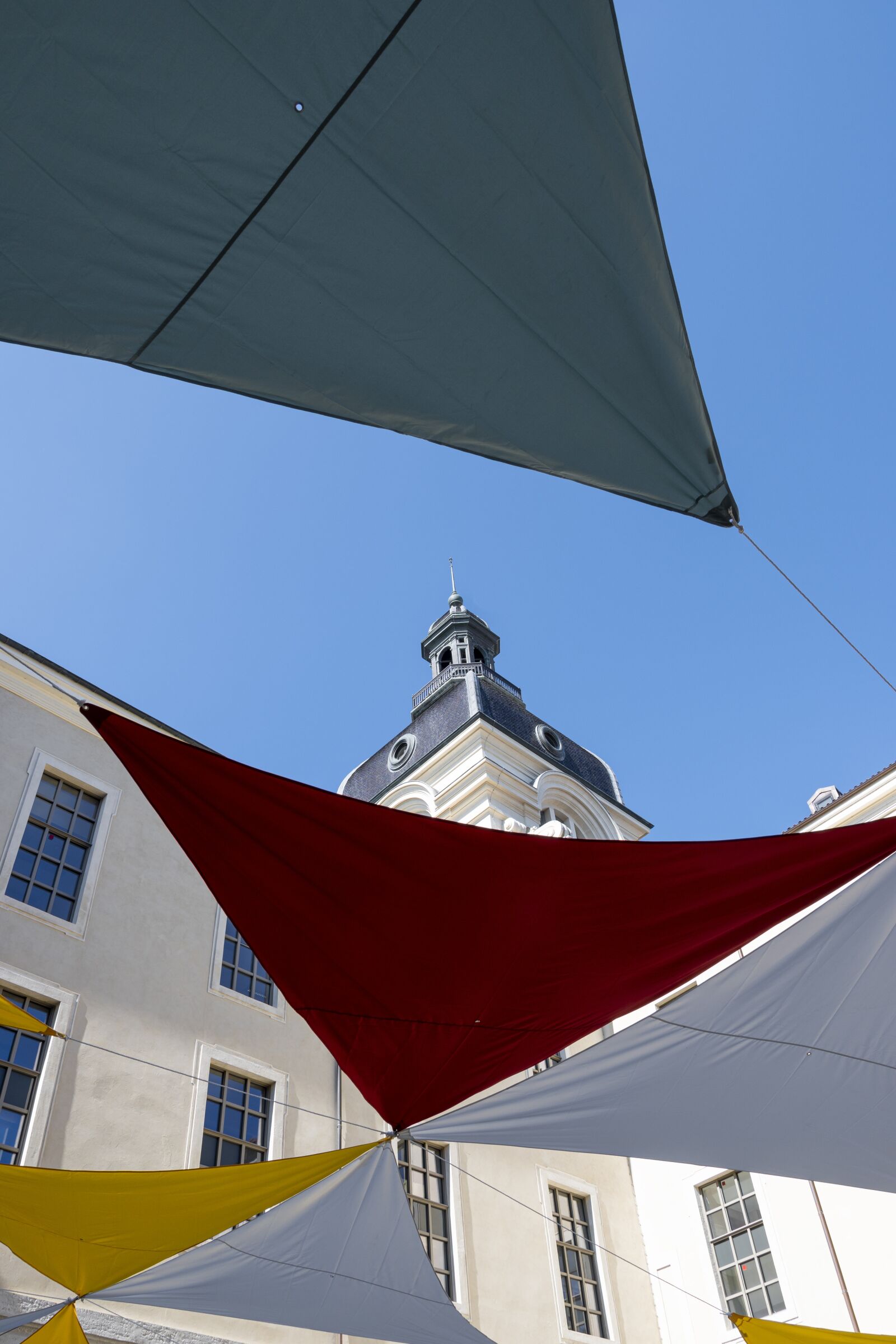 Nikon Z 50 sample photo. Bell tower, colors, pennants photography