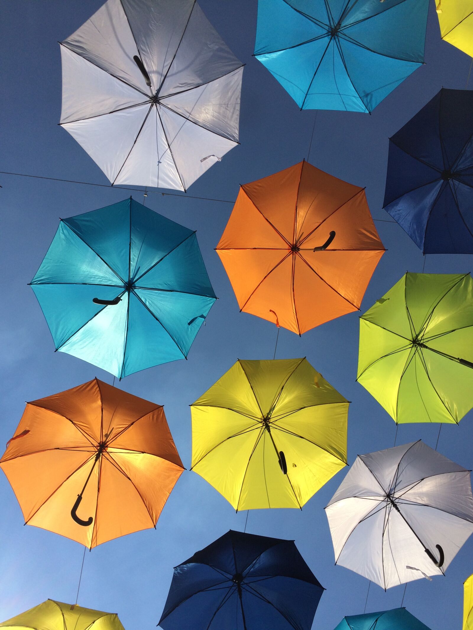 iPhone 5s back camera 4.15mm f/2.2 sample photo. Colorful umbrellas, suspended in photography