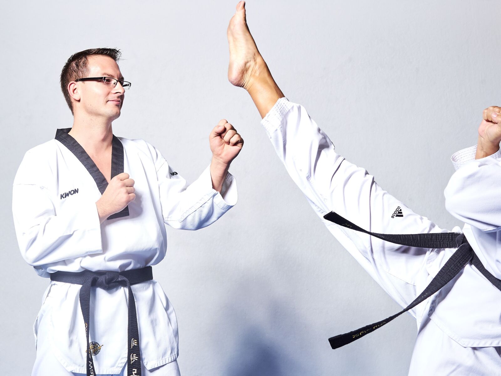 Olympus OM-D E-M1 sample photo. Taekwondo, fight, kick photography