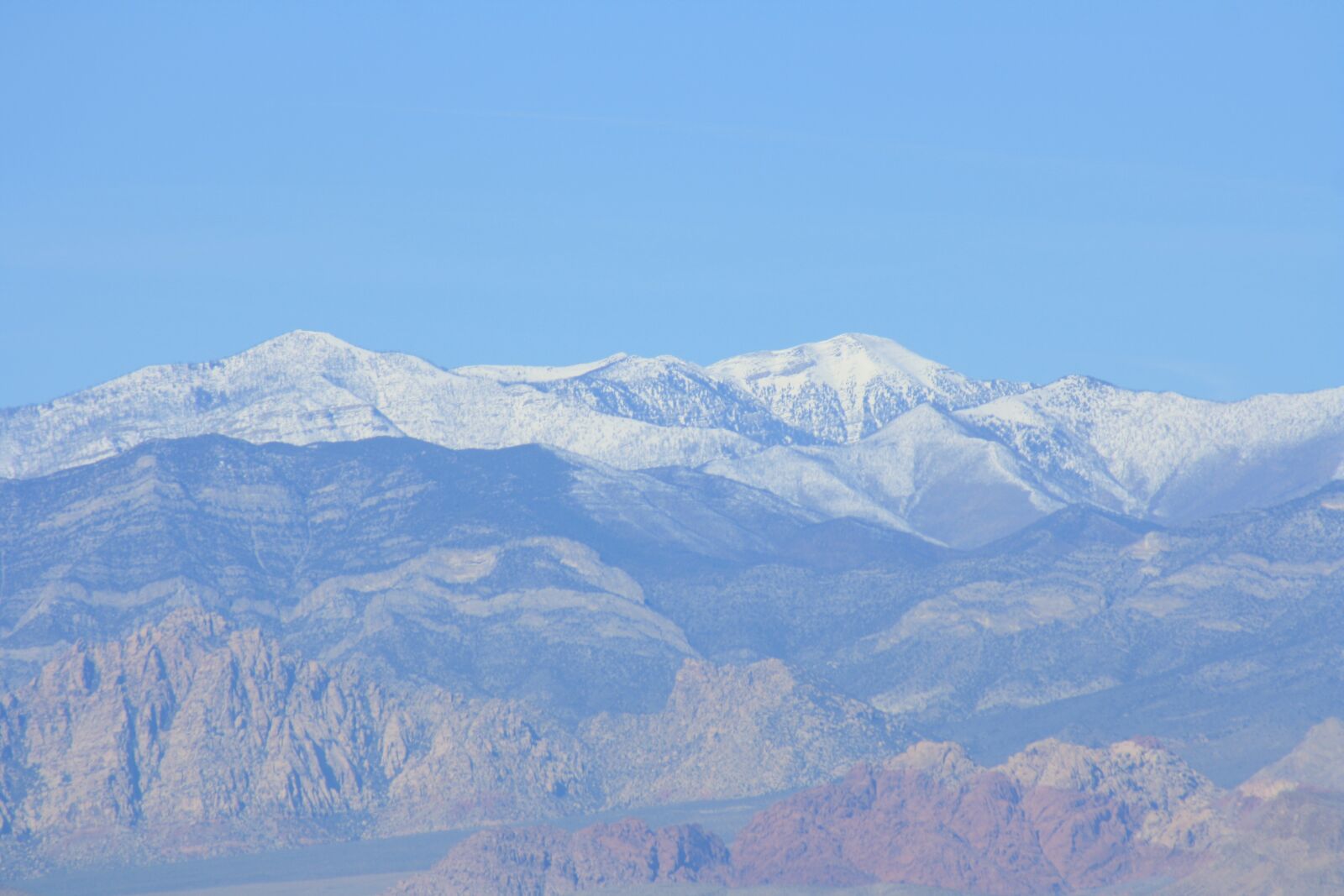 Canon EOS 1000D (EOS Digital Rebel XS / EOS Kiss F) sample photo. Snowy, mountain, red rock photography