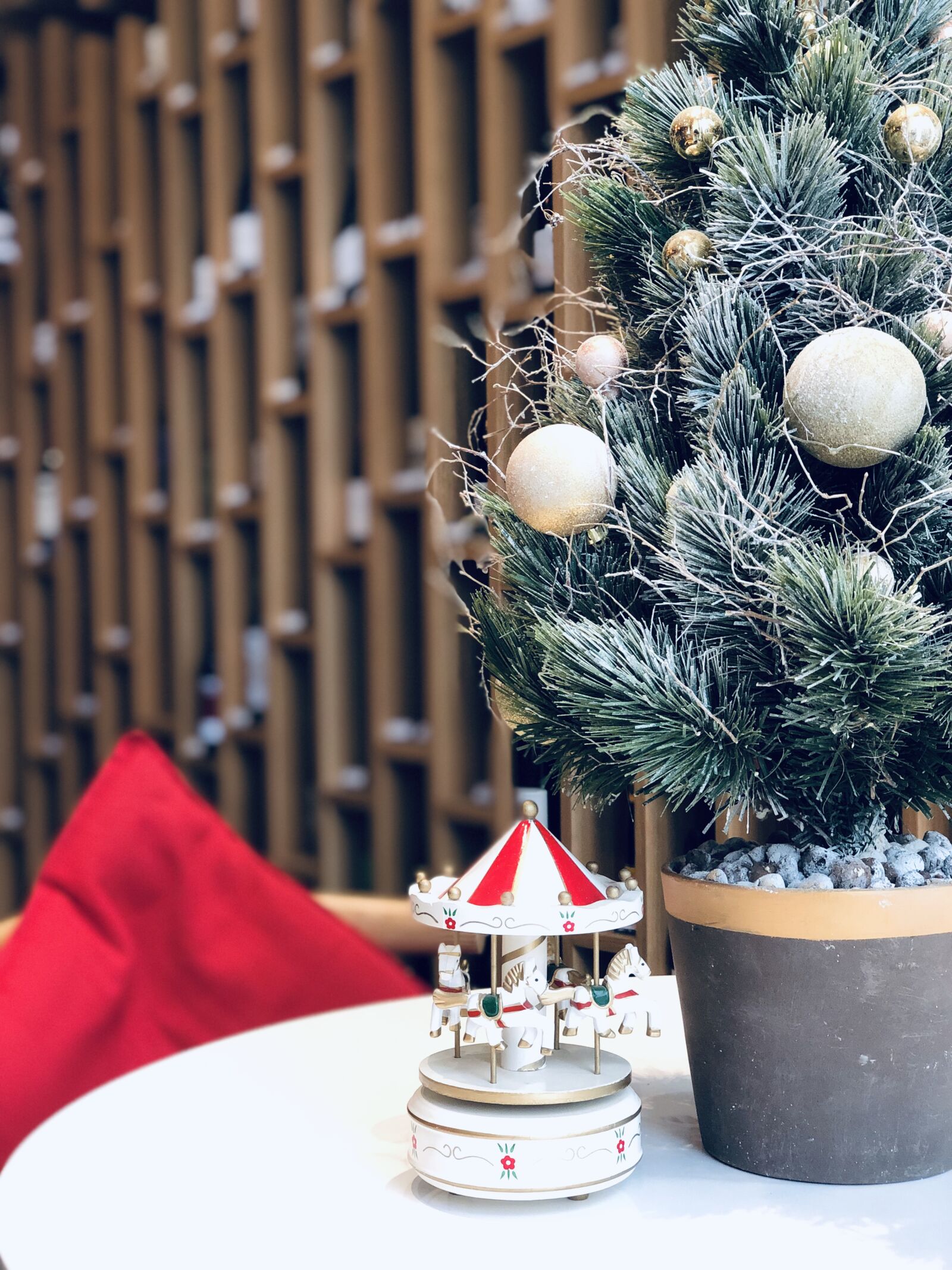 iPhone X back dual camera 6mm f/2.4 sample photo. Christmas tree, carousel, toy photography