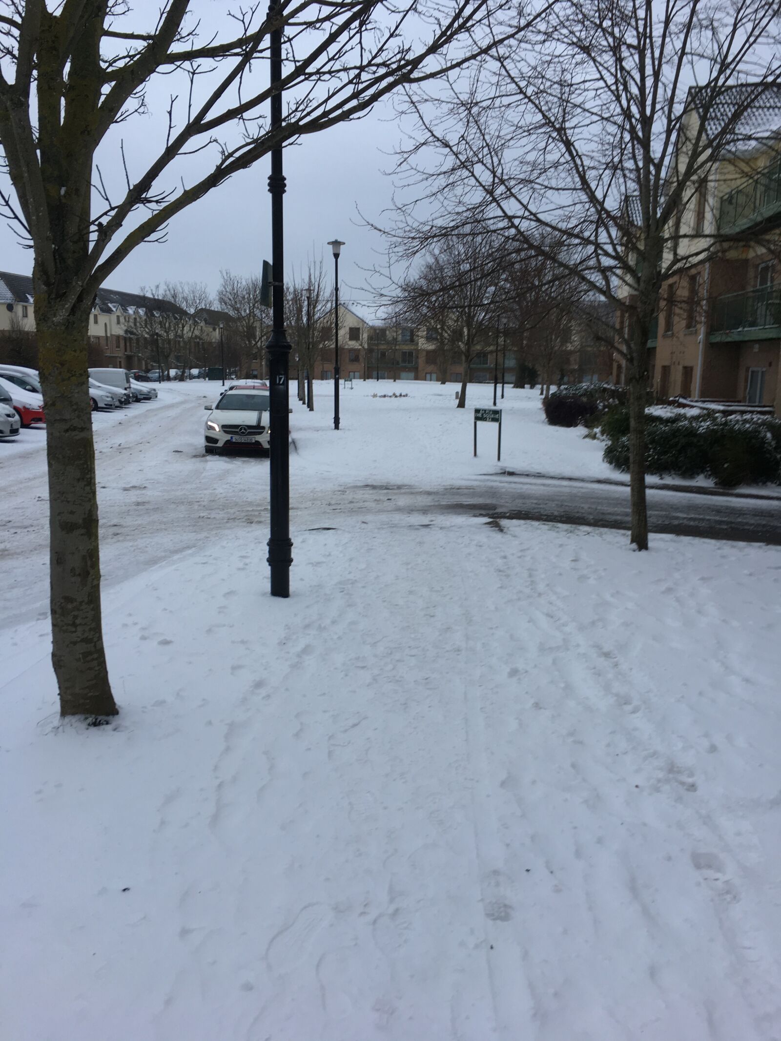 iPhone SE back camera 4.15mm f/2.2 sample photo. Snow, car, pathway photography