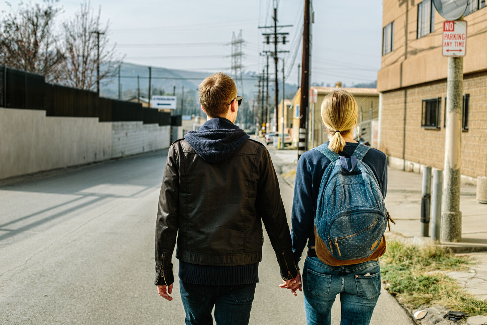 Canon EF 50mm F1.4 USM sample photo. Man, and, woman, holding photography