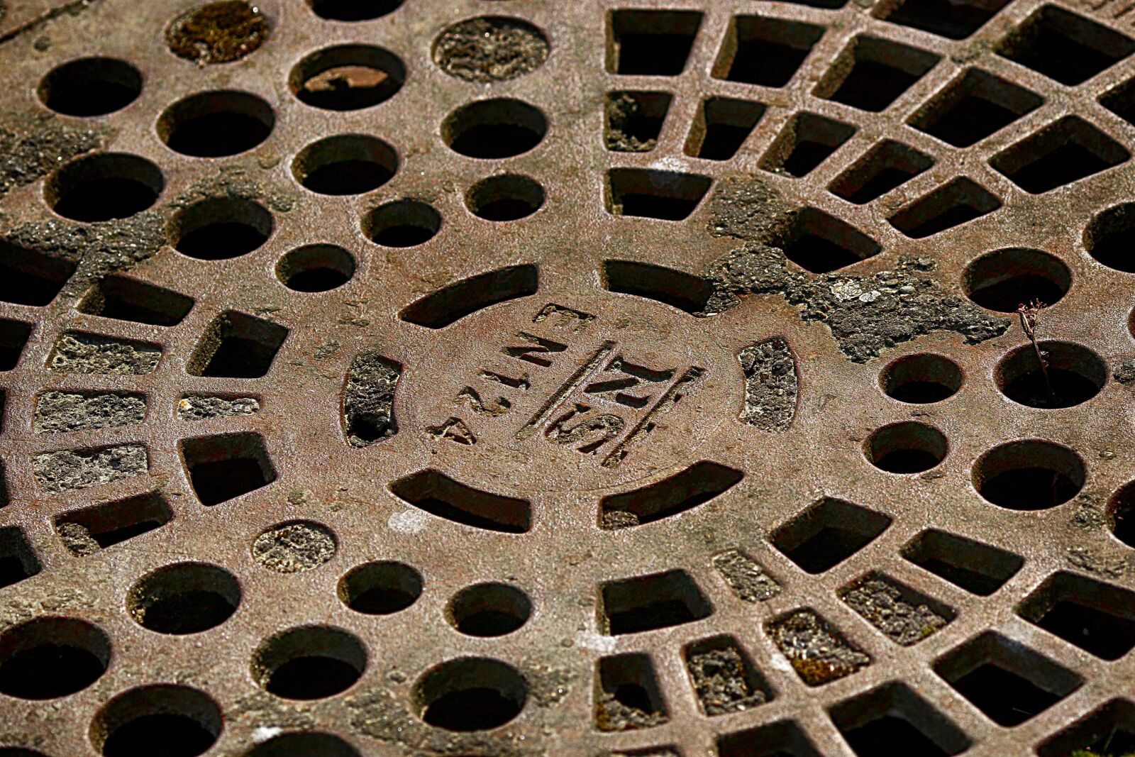 Canon EOS 7D Mark II + Canon EF 135mm F2L USM sample photo. Manhole covers, outdoors, industrial photography