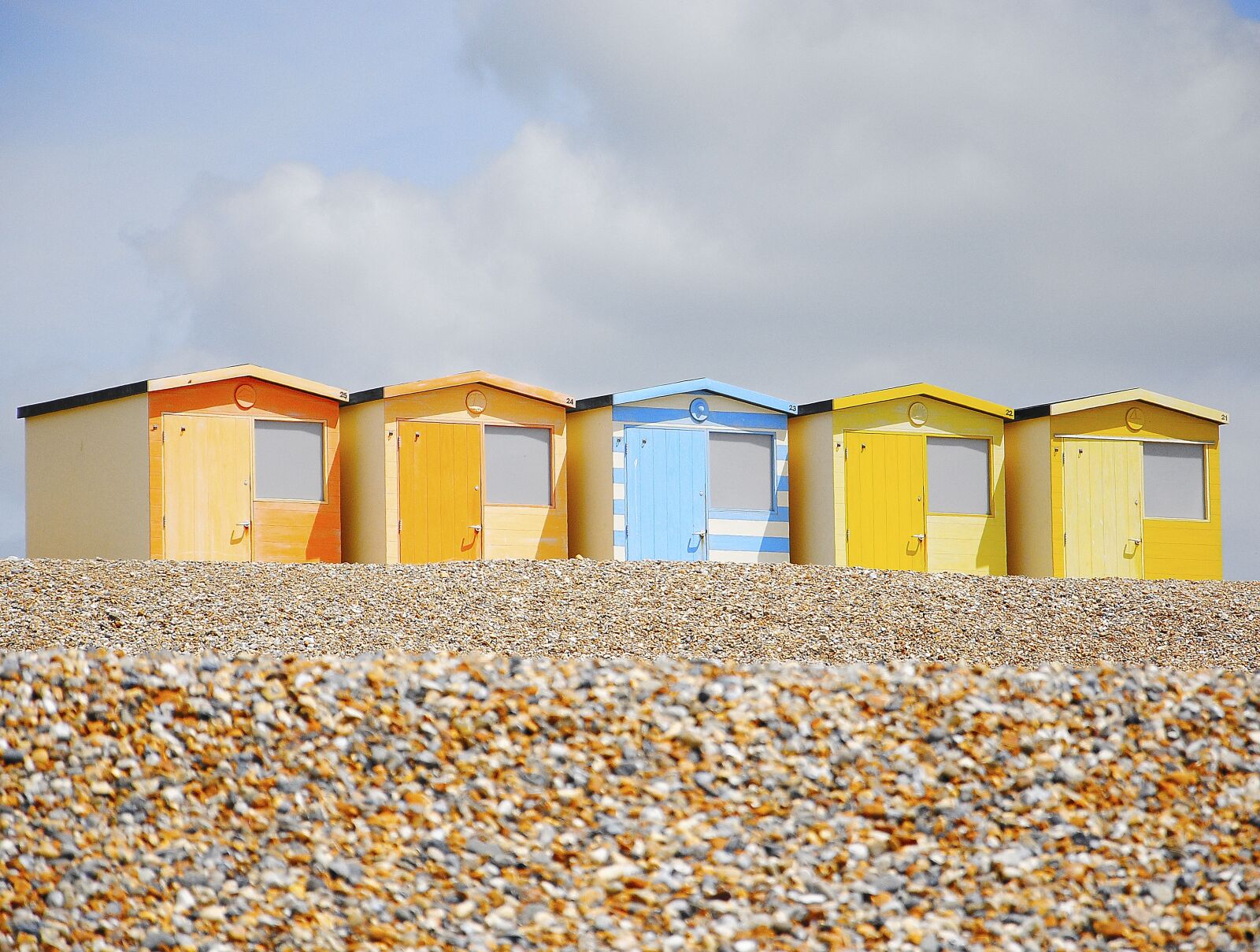 Nikon D3000 sample photo. Beach, beach hut, pebbles photography