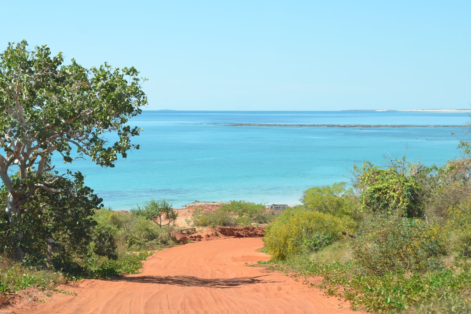 Nikon D5100 sample photo. Red sand, ocean, scenic photography