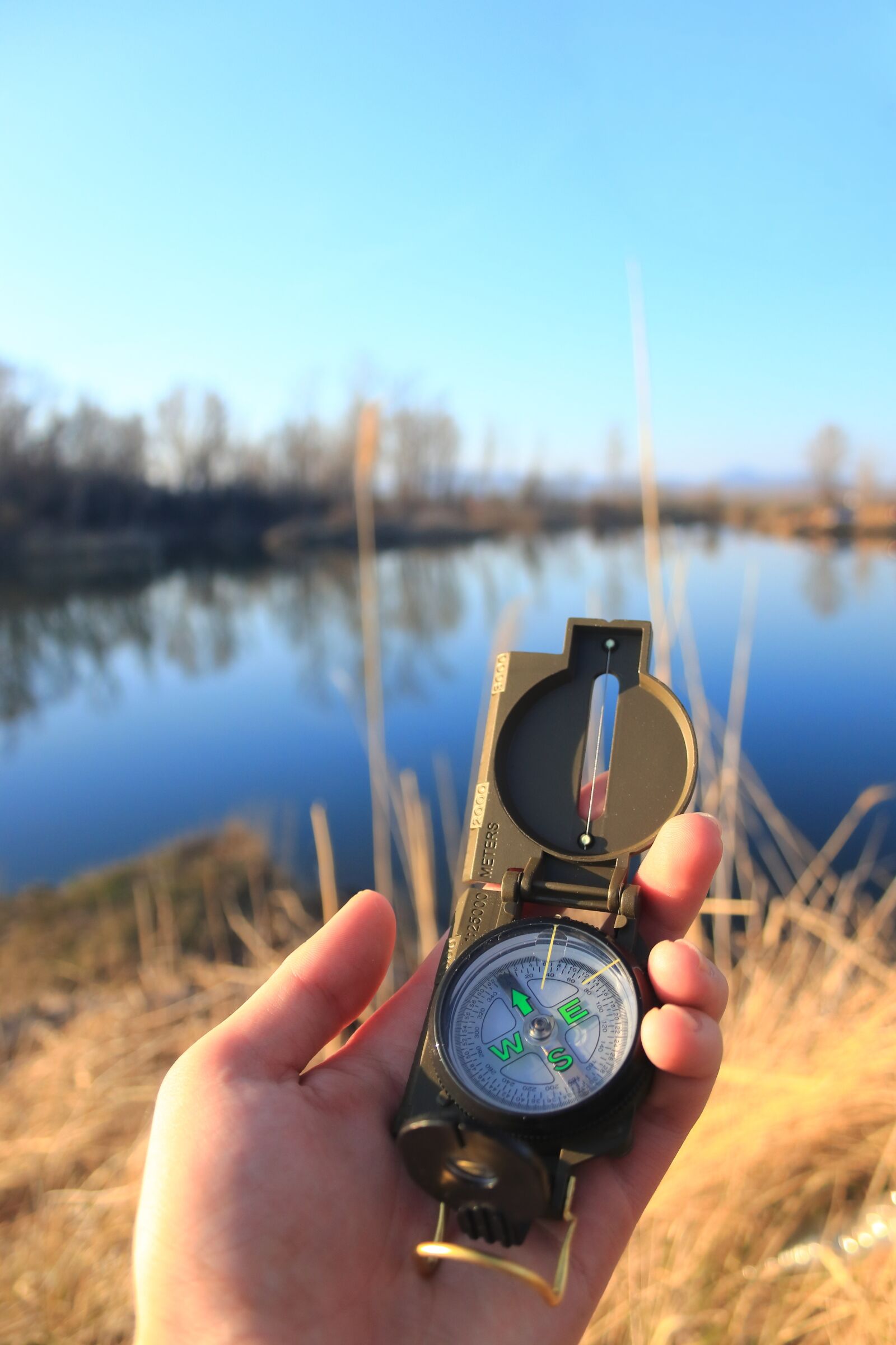 Canon EF-S 18-55mm F3.5-5.6 II sample photo. Compass, lake, water photography