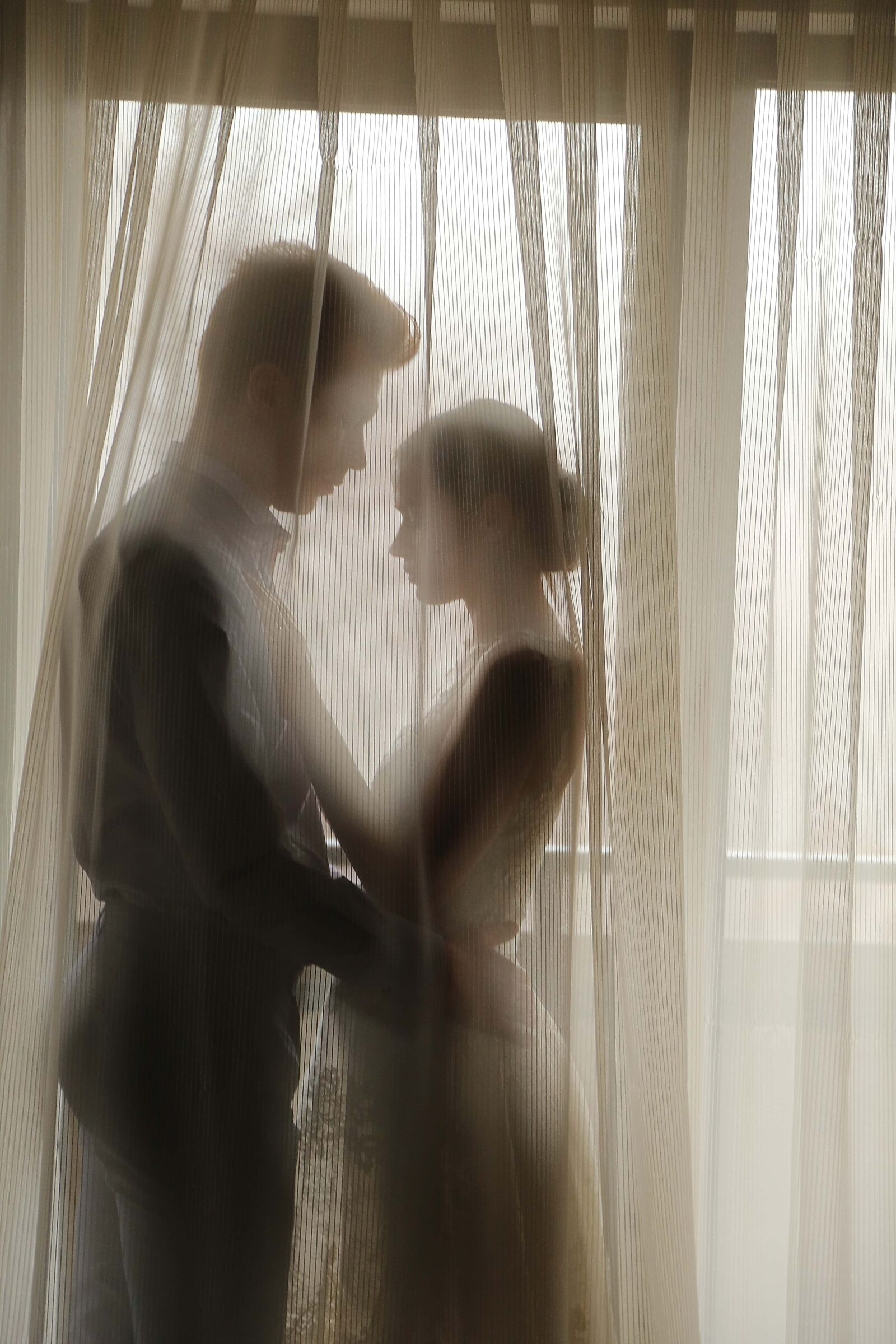 Canon EF 24-105mm F4L IS USM sample photo. Bride, groom, windows, curtain photography