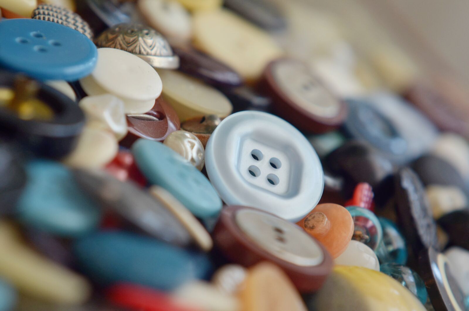 Nikon D7000 sample photo. Button, knob, haberdashery photography