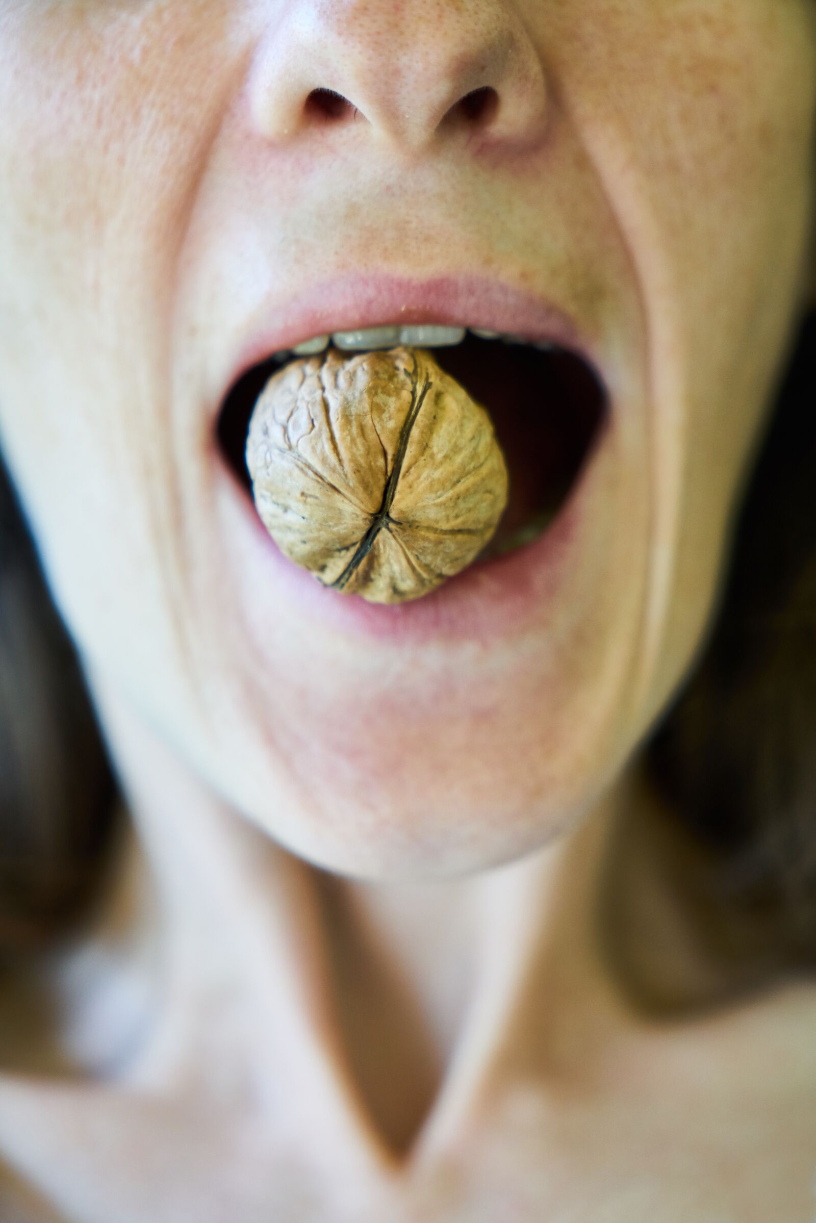 Sony a7R II sample photo. Walnut, woman, food photography