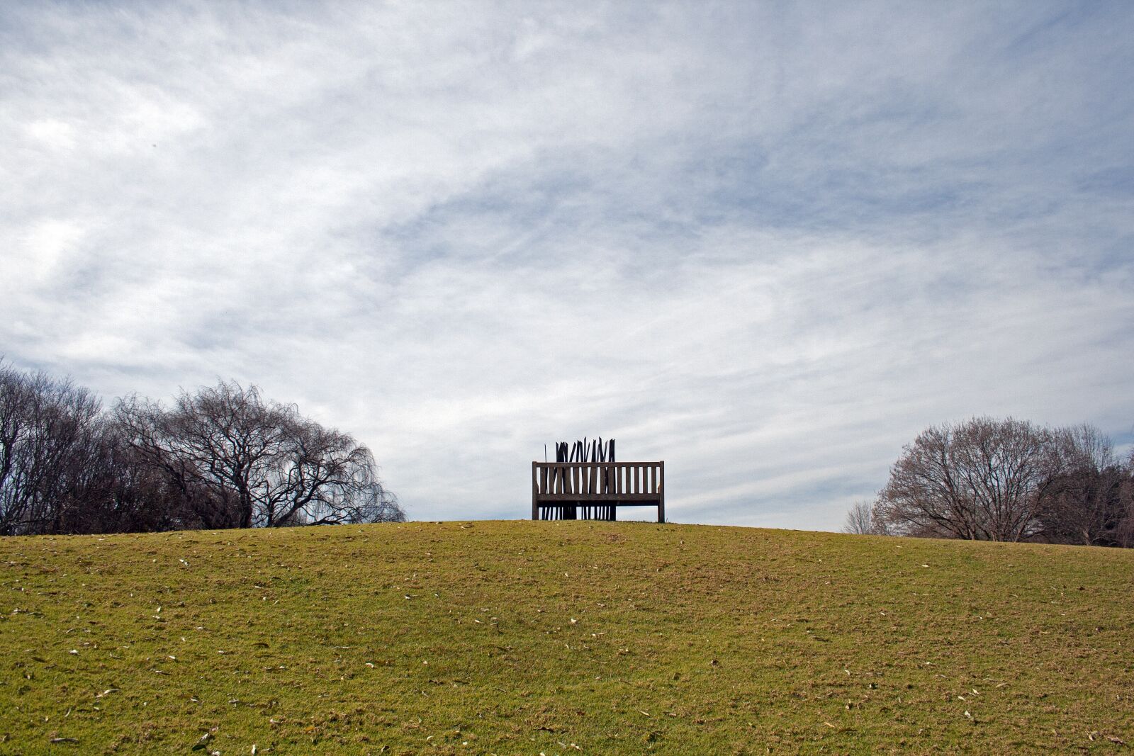 Canon EF-S 18-55mm F3.5-5.6 II sample photo. Sculpture, bench, art photography