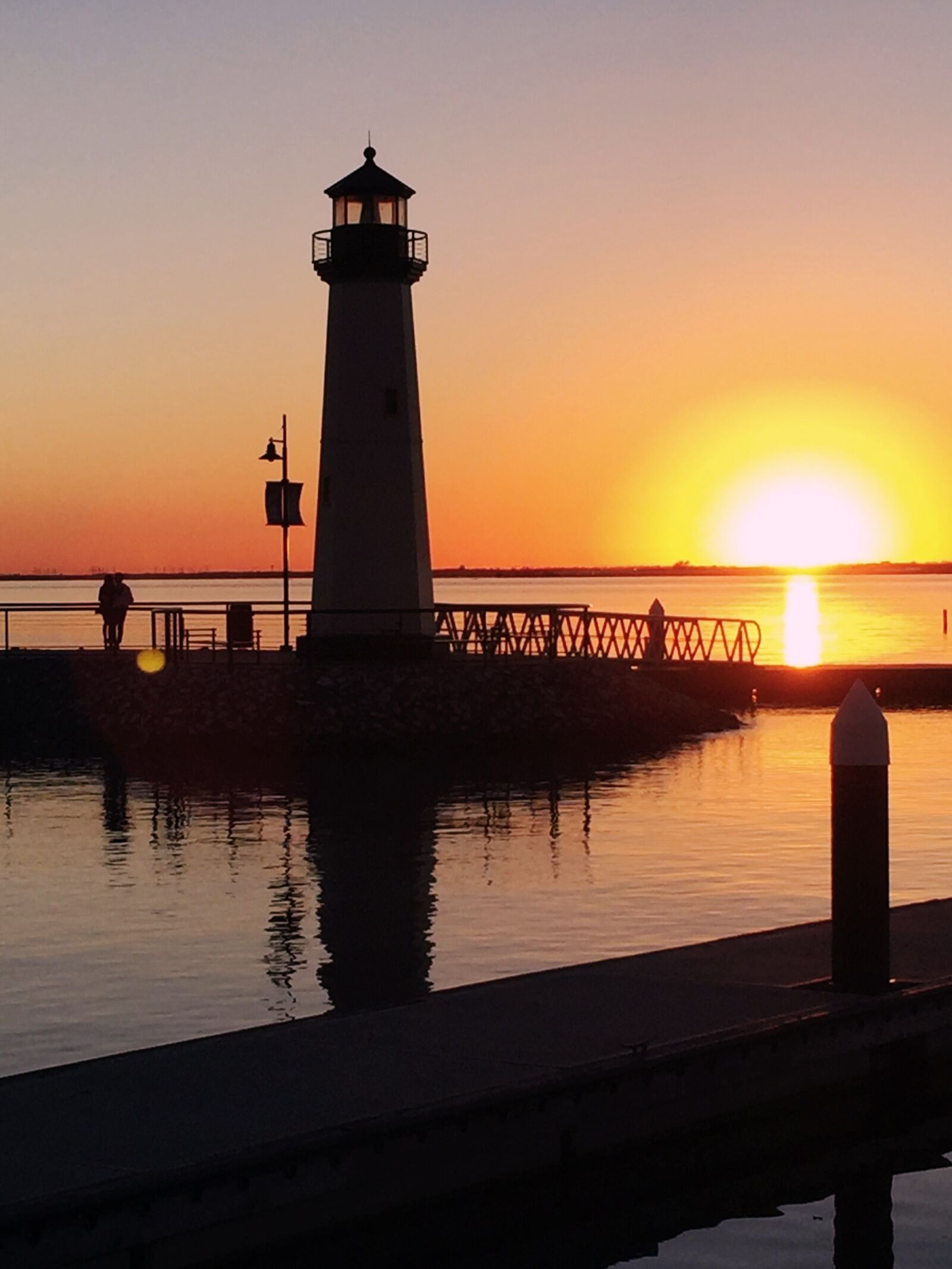 Apple iPhone 6 sample photo. Water, sunset, lighthouse photography