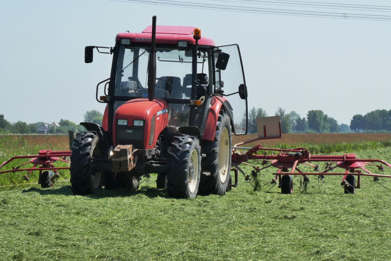 Panasonic Lumix DC-ZS70 (Lumix DC-TZ90) sample photo. Tractor, grass, agriculture photography