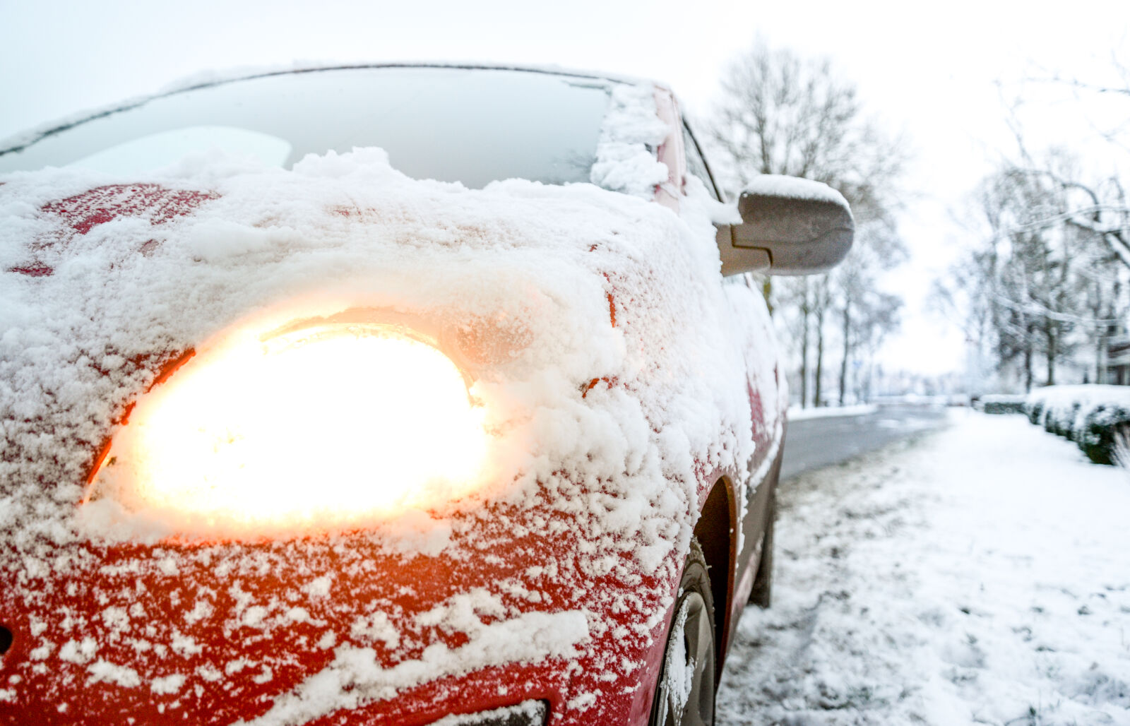 Nikon D610 sample photo. Snow, covered, red, sedan photography