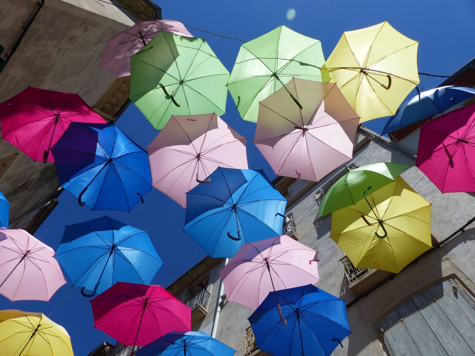 Panasonic Lumix DMC-FZ200 sample photo. Umbrellas, colorful, blue sky photography