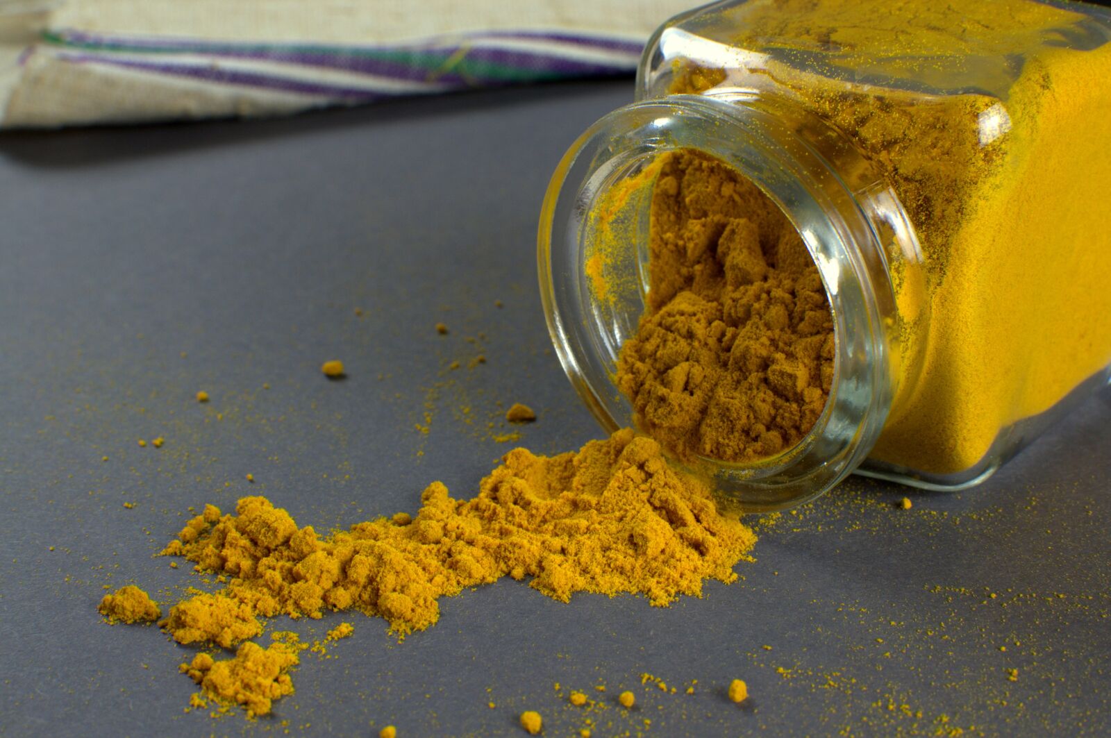 Nikon D3100 sample photo. Turmeric, glass, aromatic photography