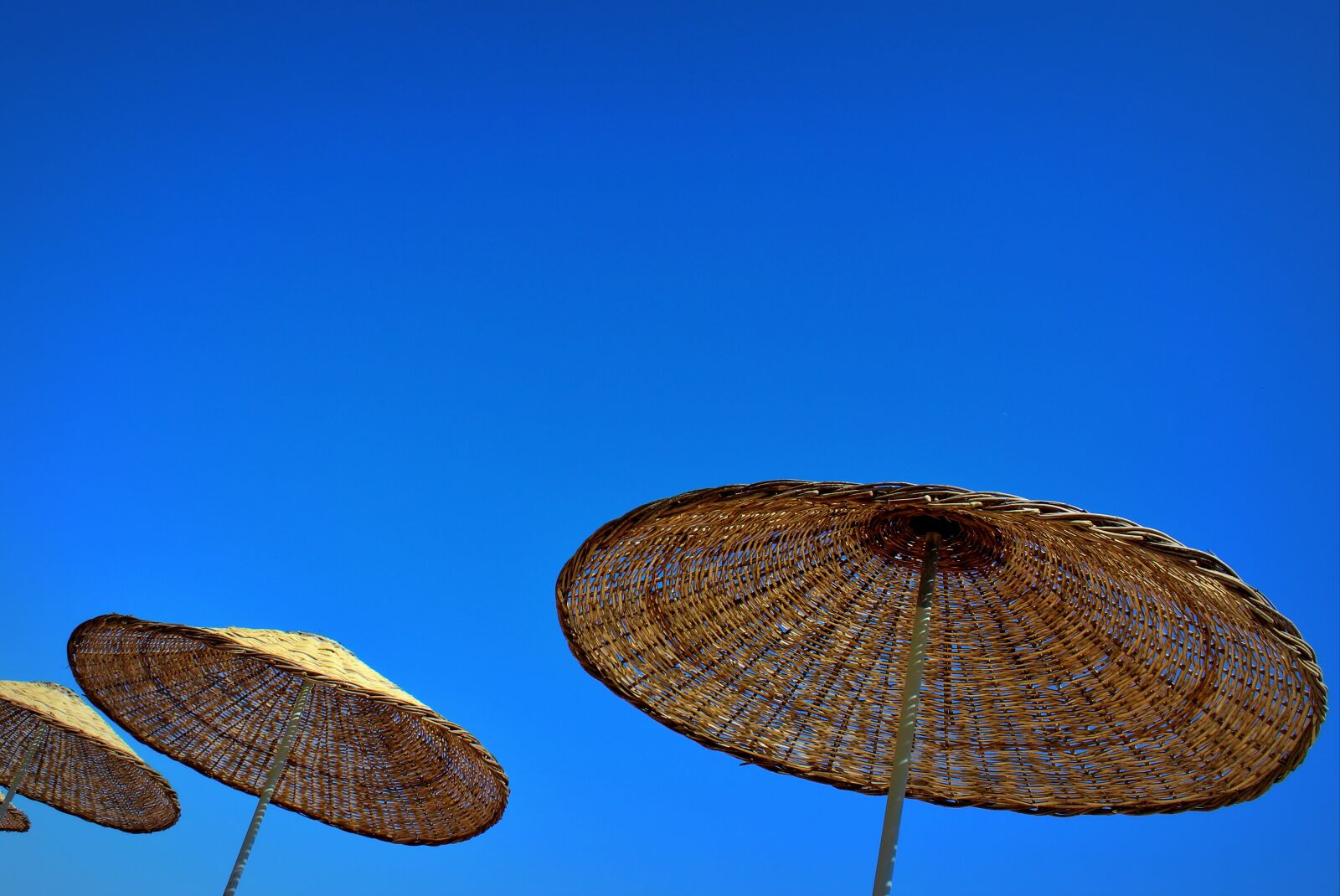 Canon EOS 600D (Rebel EOS T3i / EOS Kiss X5) sample photo. Parasols, sky, blue sky photography