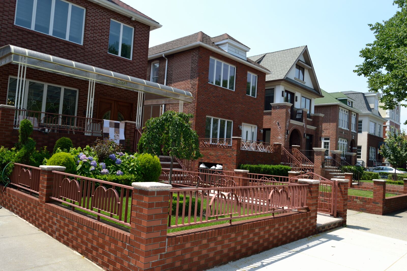 Nikon D3100 sample photo. Two family homes, brick photography