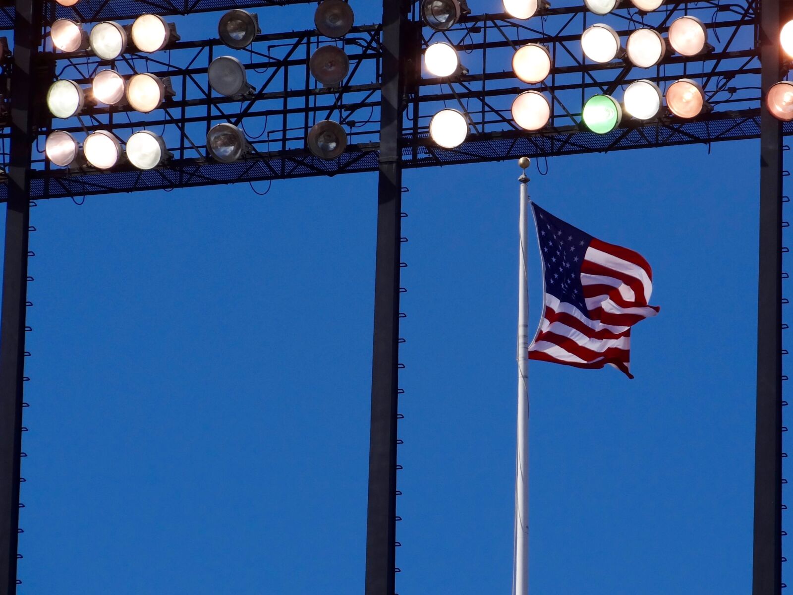 Sony Cyber-shot DSC-HX100V sample photo. Flag, lights, stadium photography