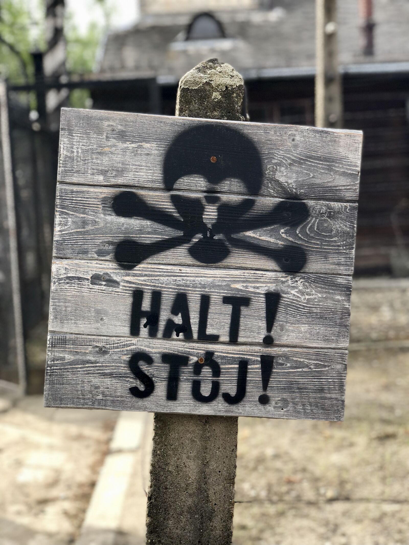 iPhone X back dual camera 6mm f/2.4 sample photo. Auschwitz, sign, stop photography