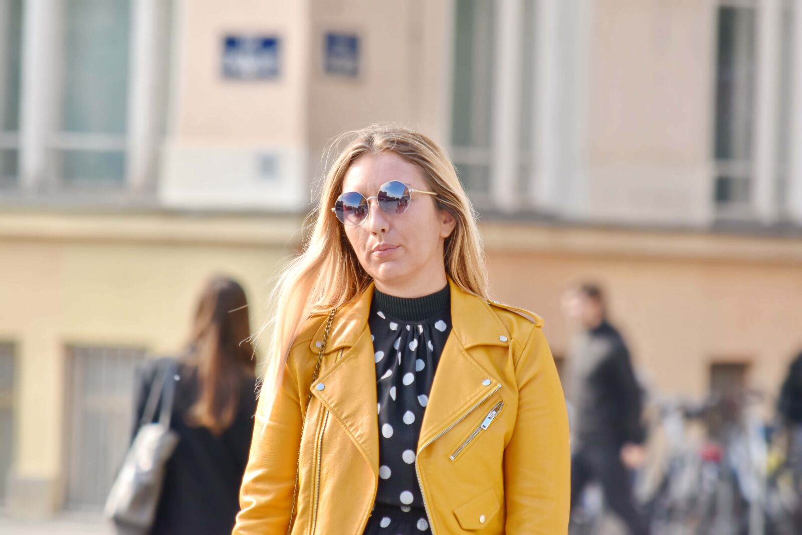 Nikon D5500 sample photo. Blonde hair, coat, confidence photography