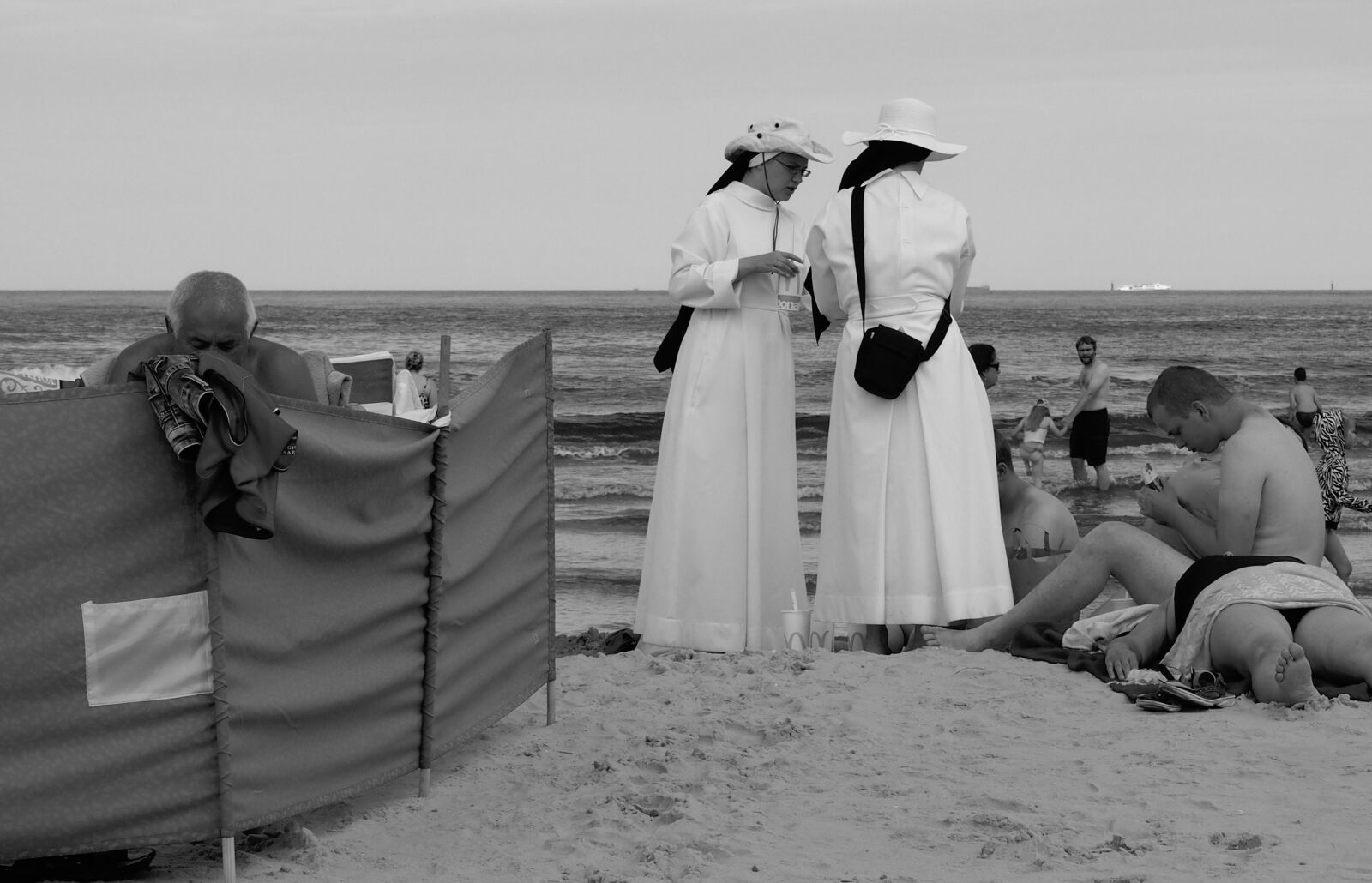 Olympus PEN E-PL6 sample photo. Beach, people, nuns photography