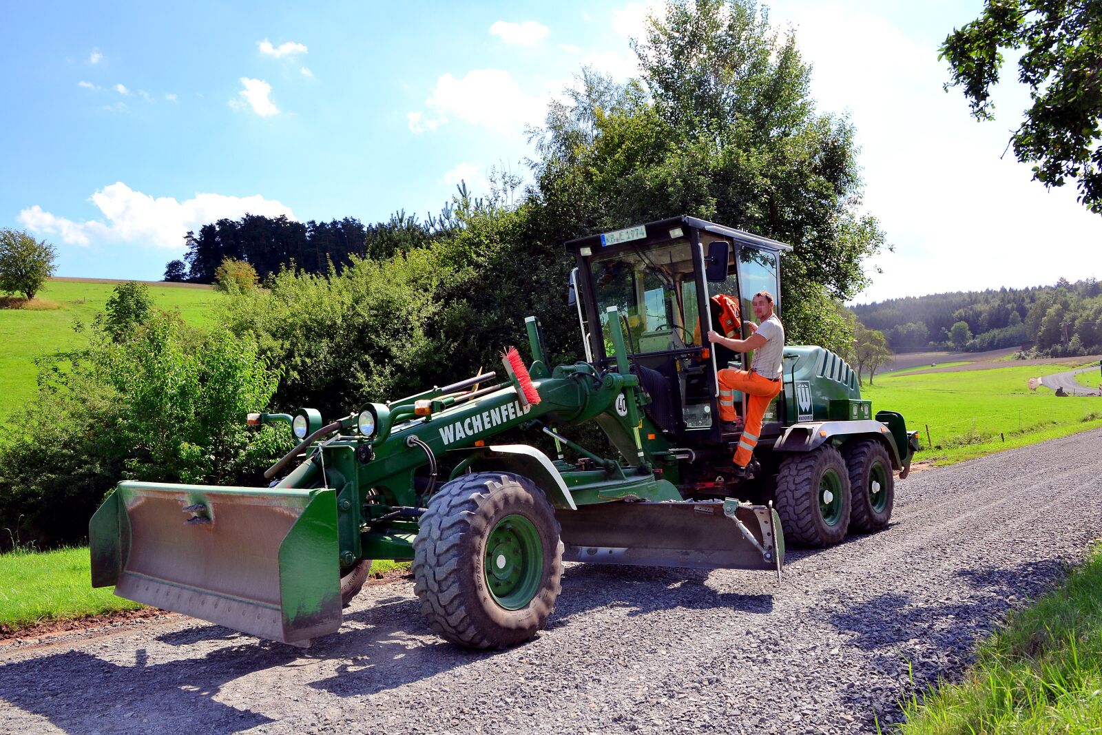 Nikon D3100 sample photo. Road surface renew, blade photography