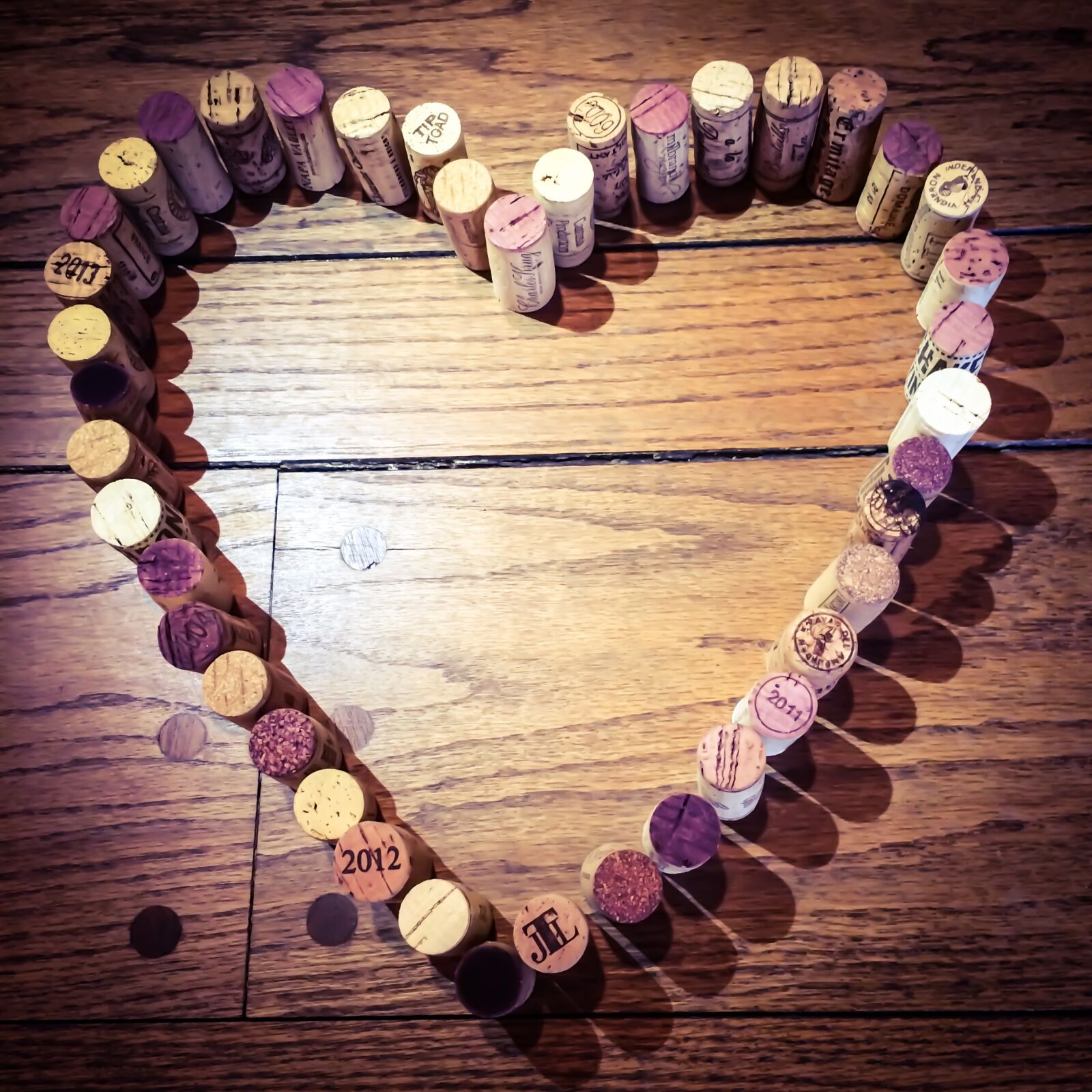 iPhone 5s back camera 4.15mm f/2.2 sample photo. Wine corks, heart, wine photography