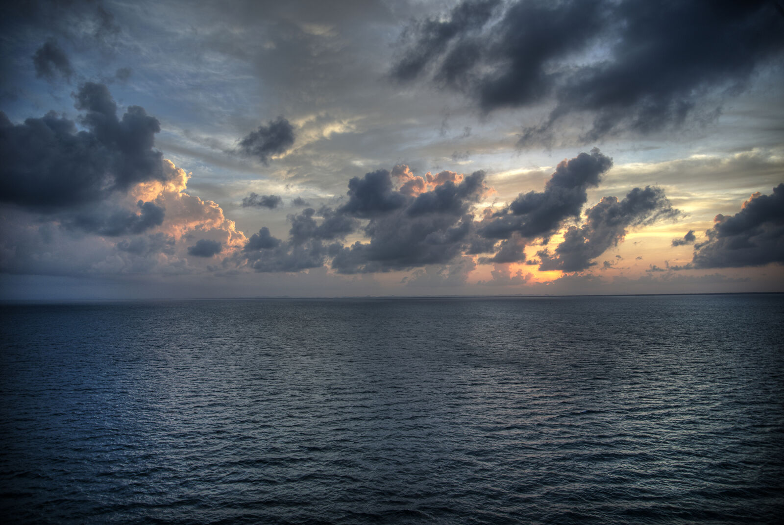 Nikon AF-S Nikkor 24-85mm F3.5-4.5G ED VR sample photo. Clouds, ocean, sunset photography