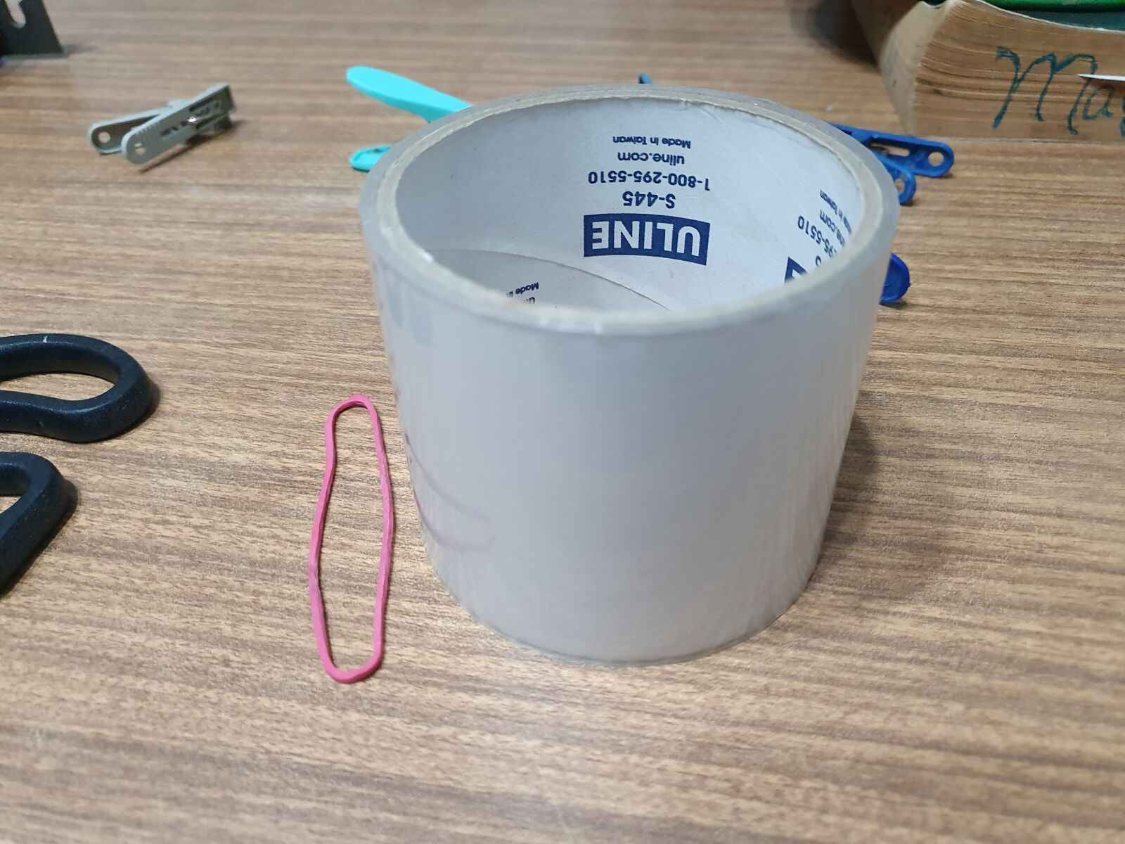 Samsung Galaxy S10 sample photo. Adhesive tape, table, earphones photography