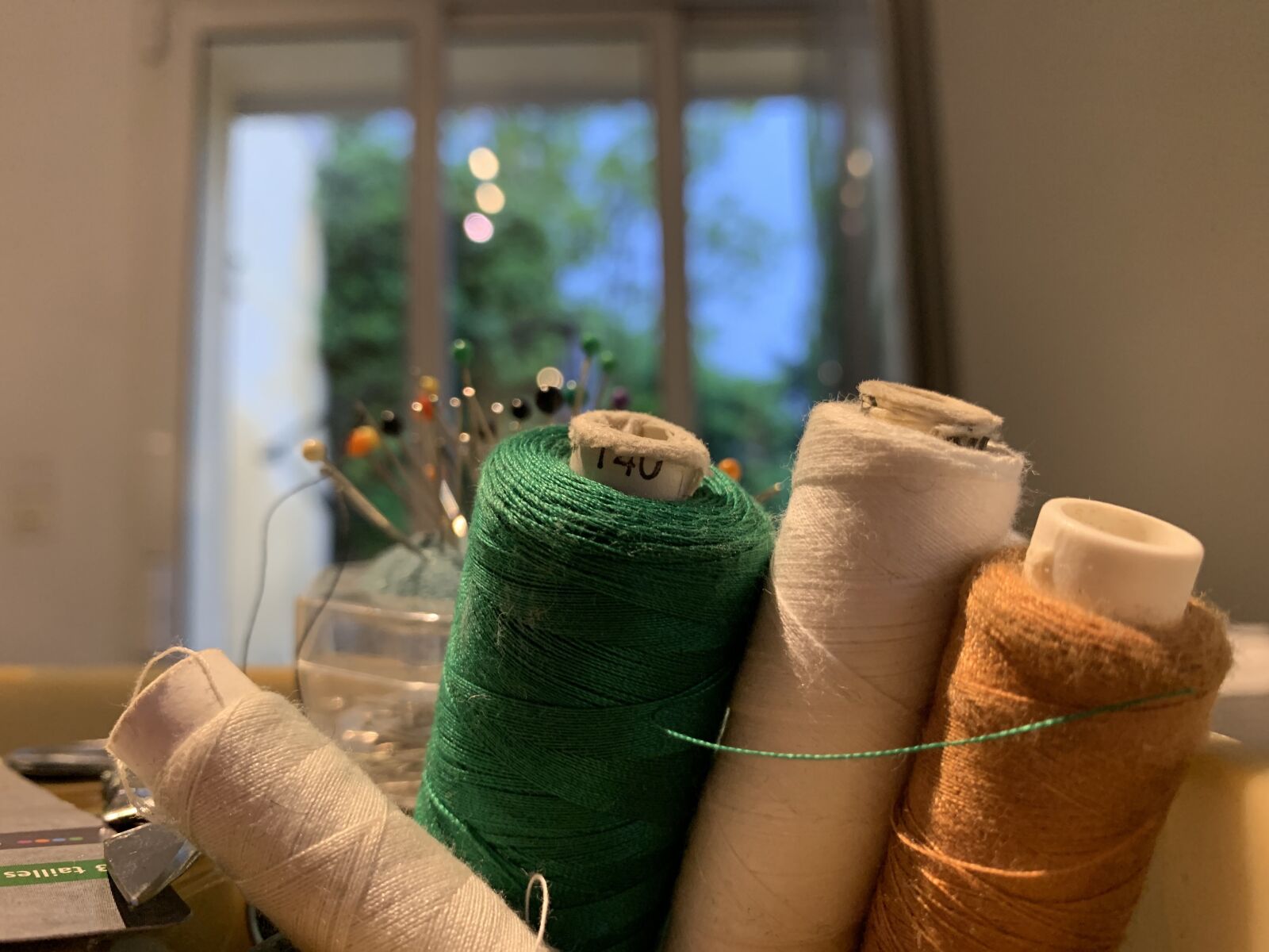 Apple iPhone XR sample photo. Thread sewing, couture, coil photography
